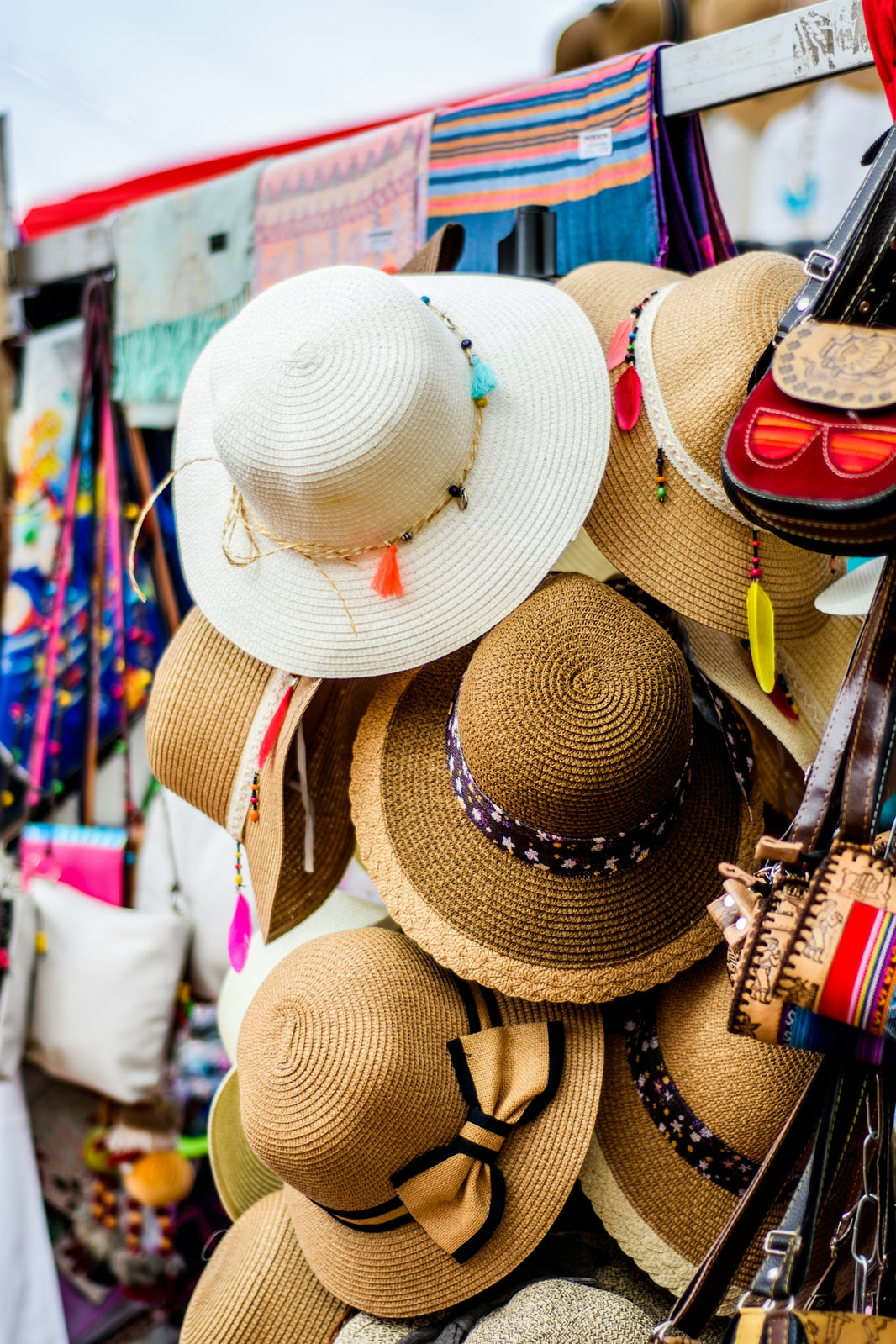 assorted brown and white sun hat display during daytime