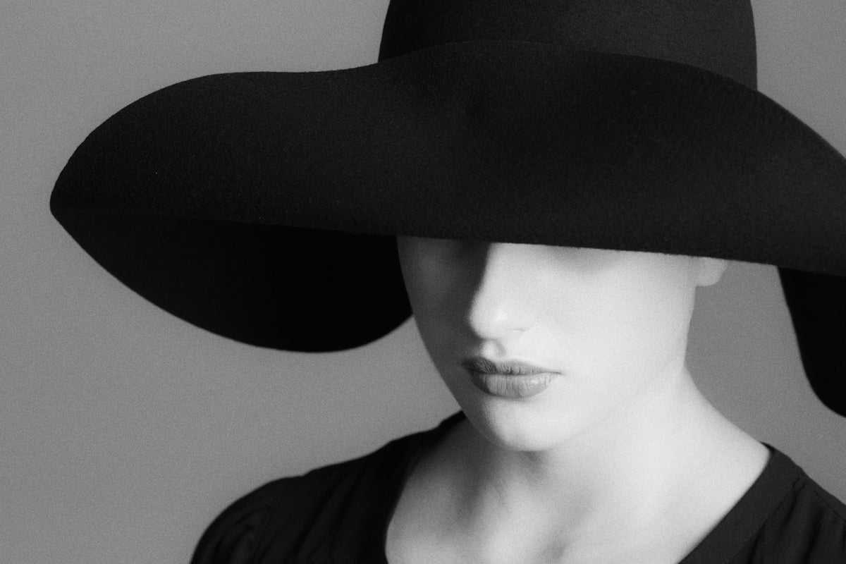 woman in black hat and black shirt