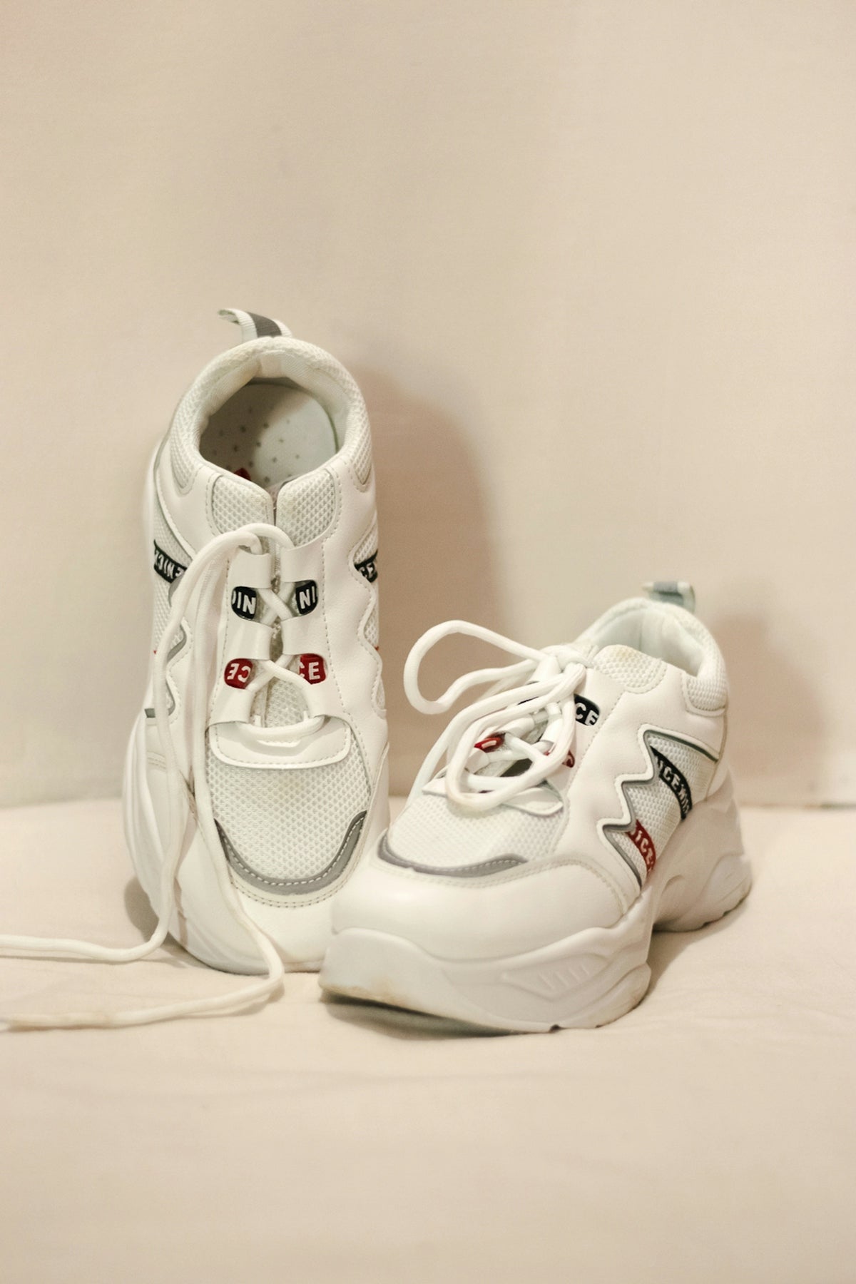 white and black nike athletic shoes