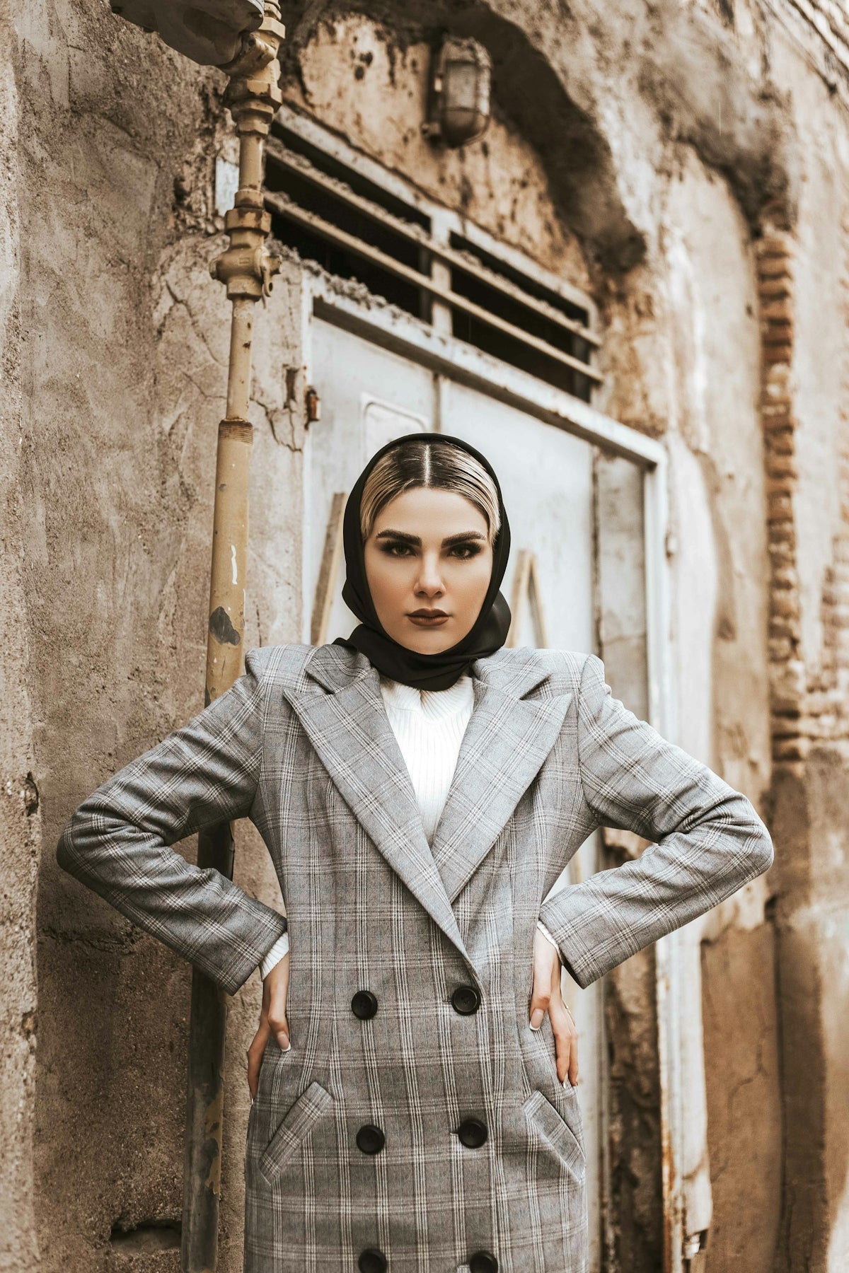 a woman standing in front of a building