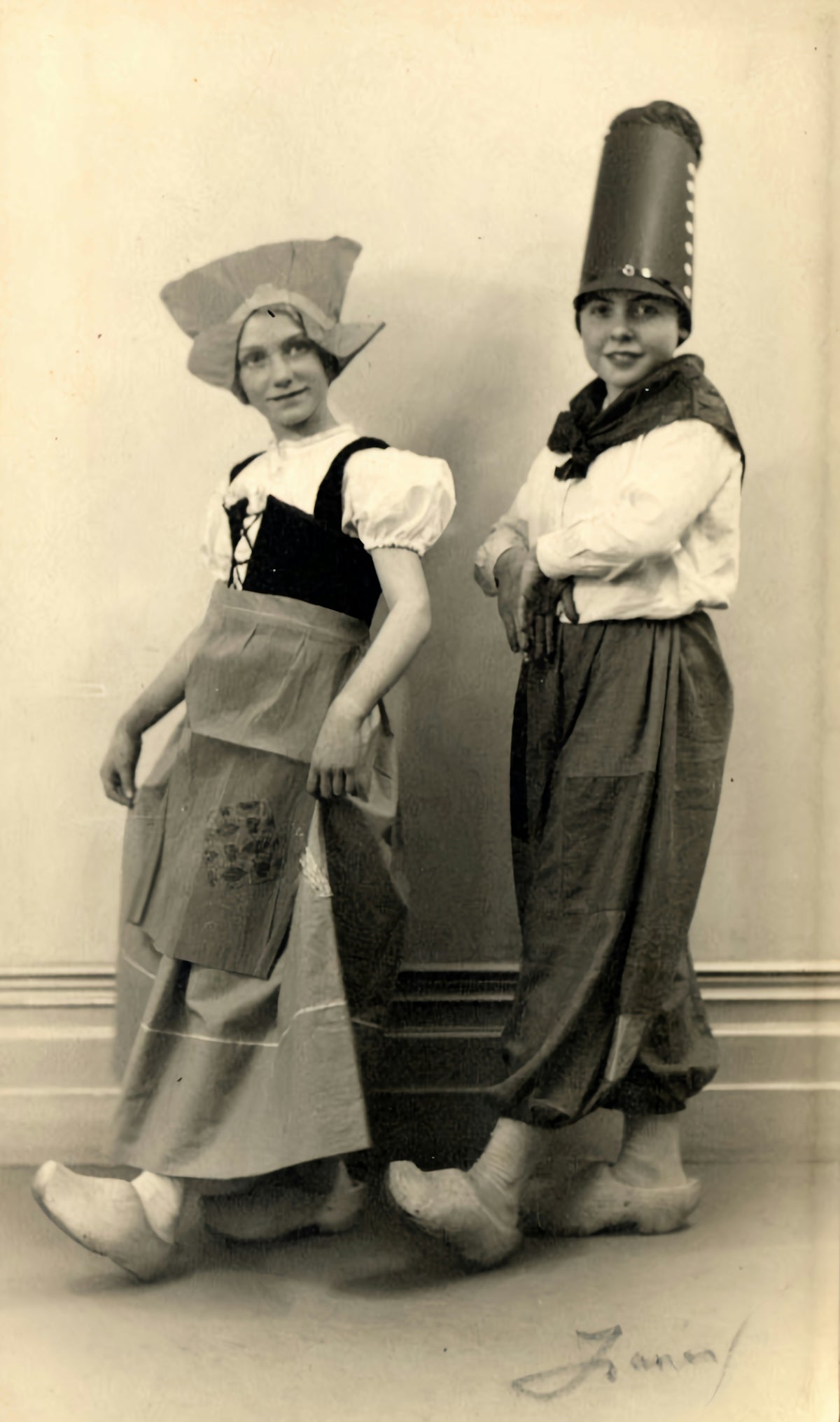 a couple of kids that are standing next to each other