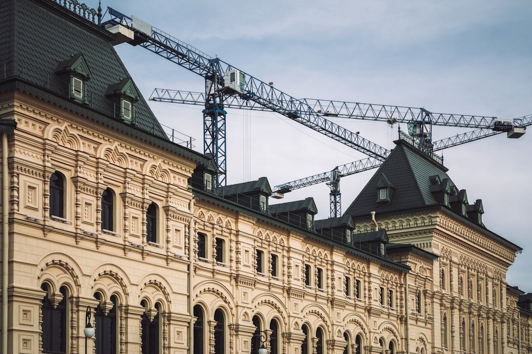 a large building with a crane on top of it