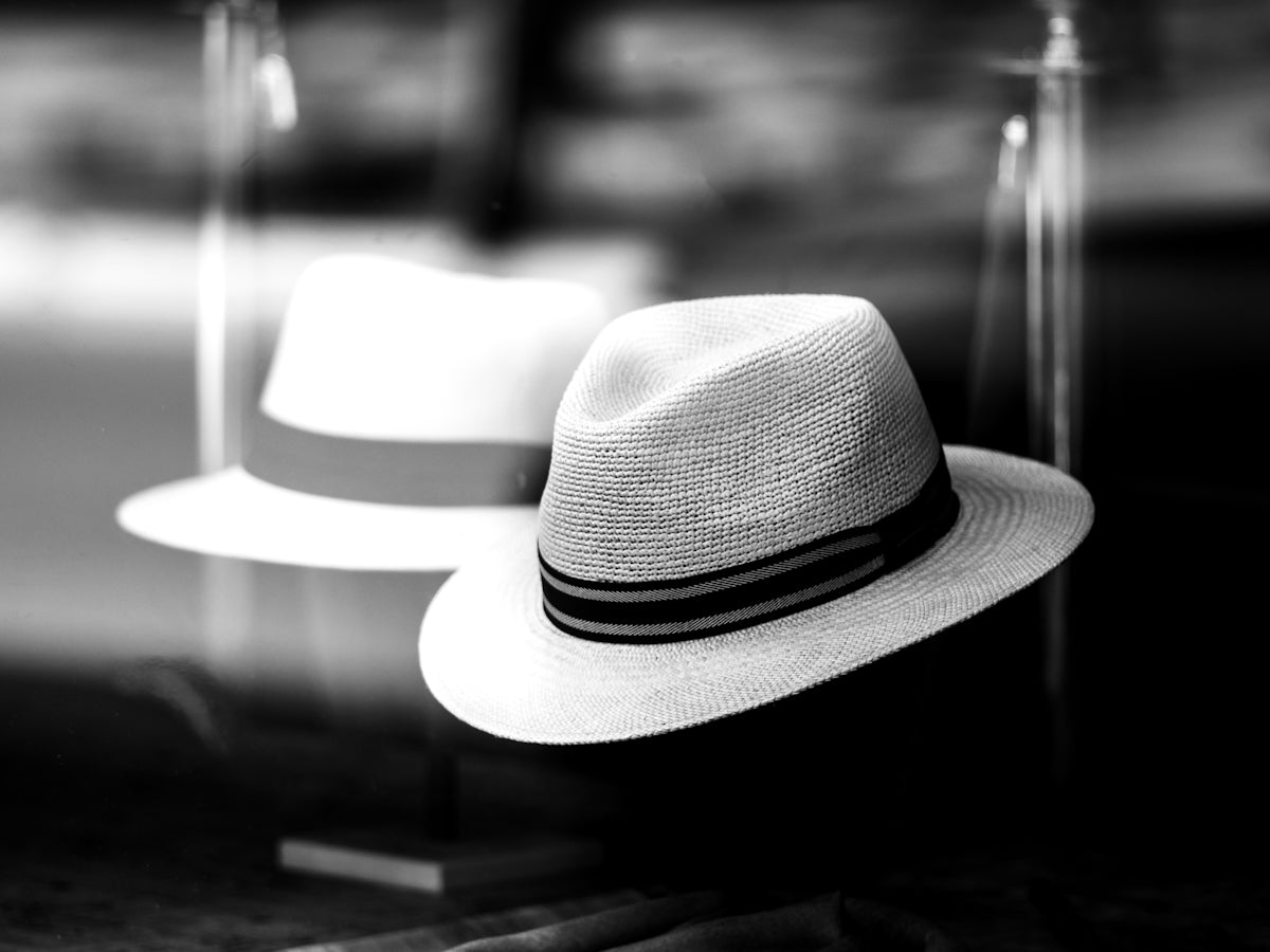 a white hat sitting on top of a table