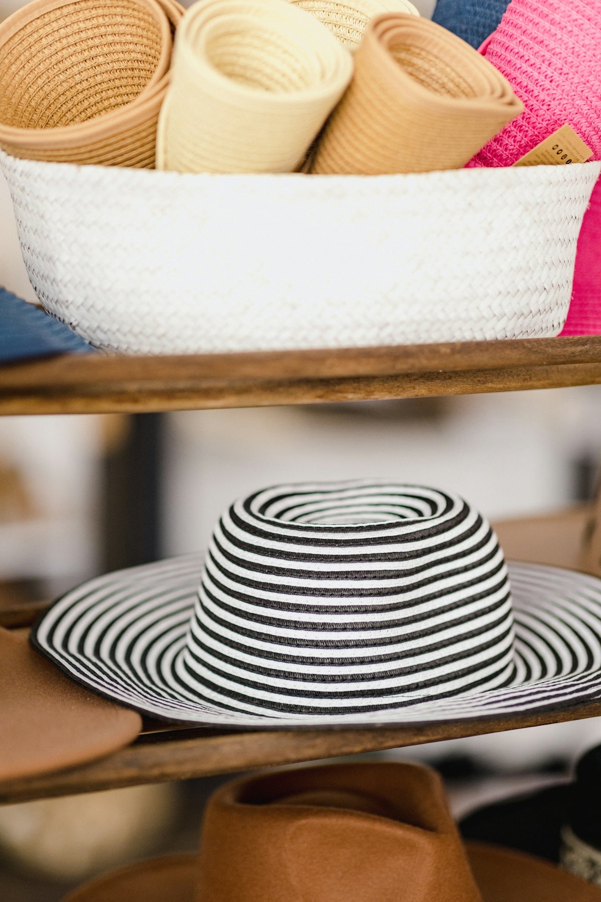a hat is sitting on a shelf in a store