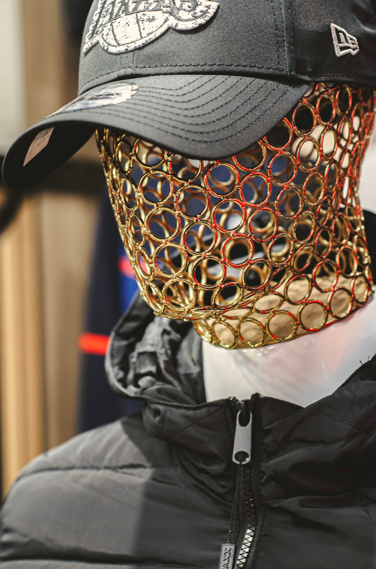 a baseball cap with a mask on top of it