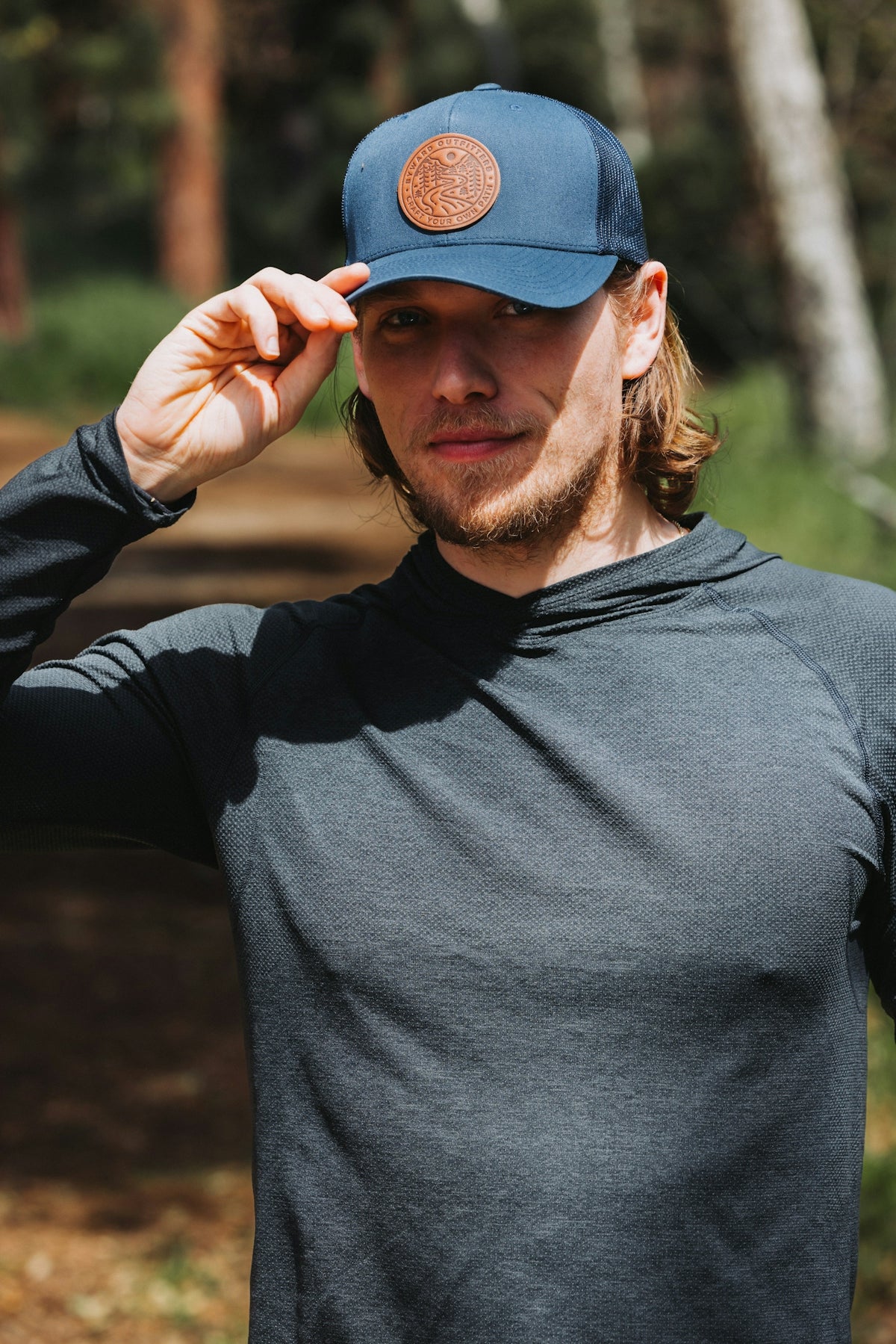 A man in a hat is posing for a picture