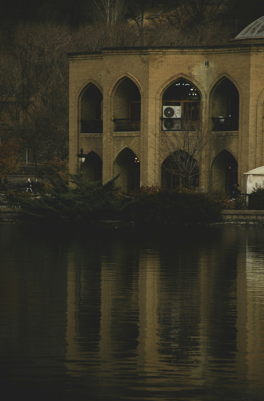 A large building sitting next to a body of water