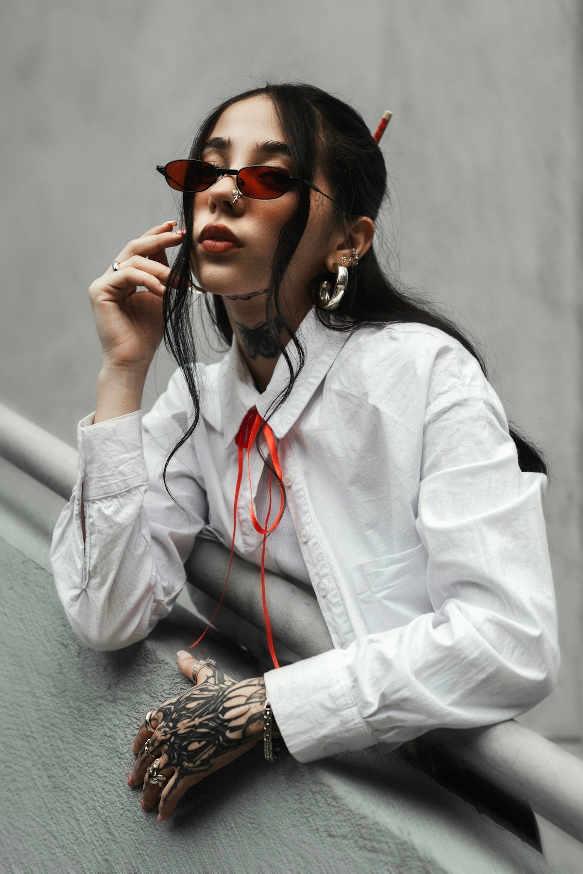 Cool woman poses with flair and style.