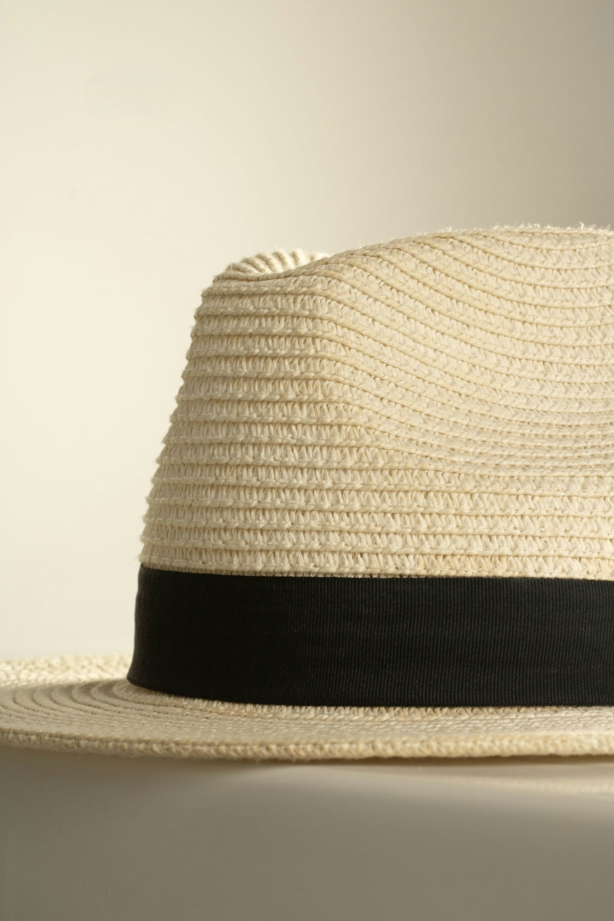 A straw hat with a black band.