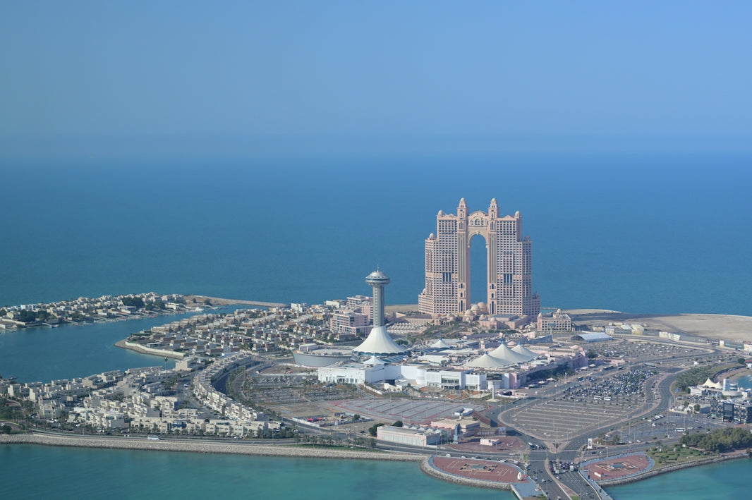 Modern city skyline with distinctive architecture on the coast.