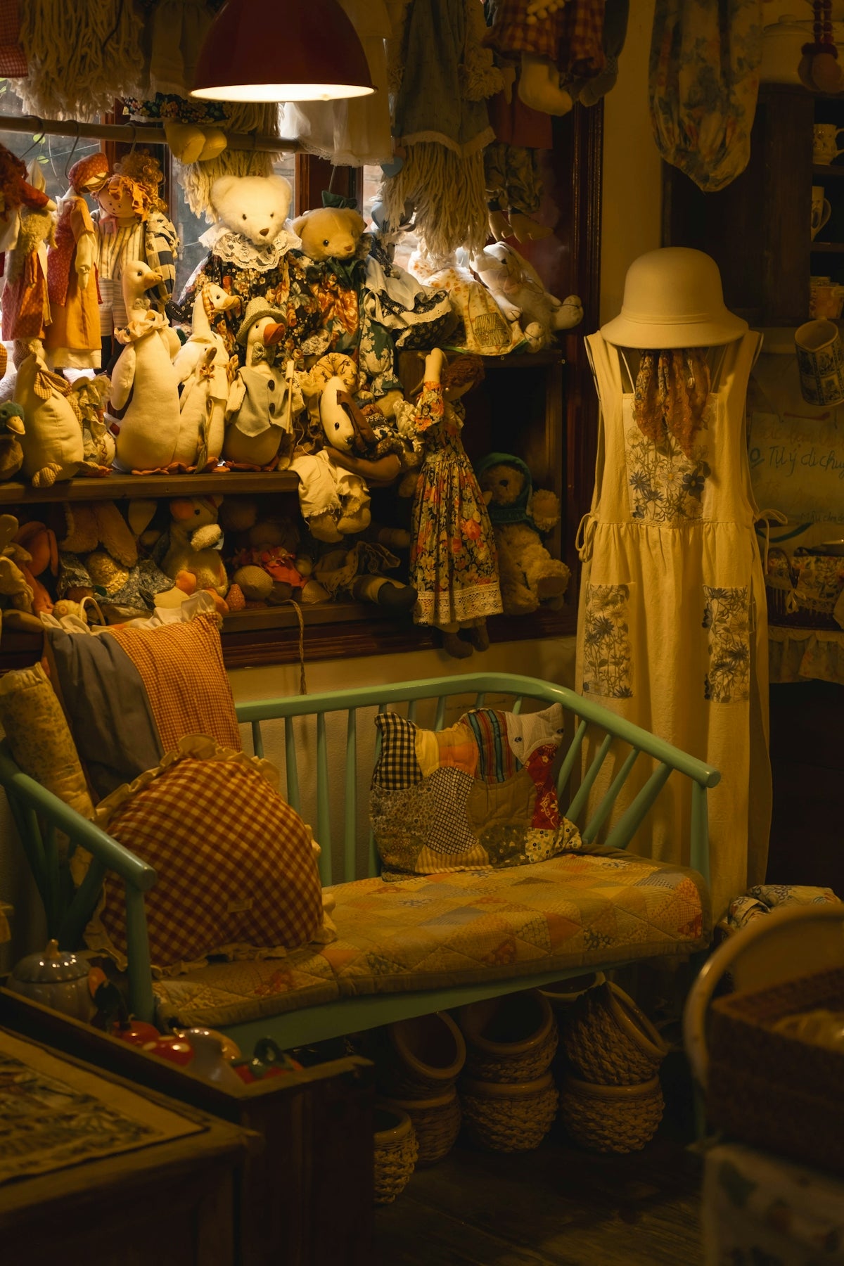 A cozy room filled with stuffed animals and vintage decor.