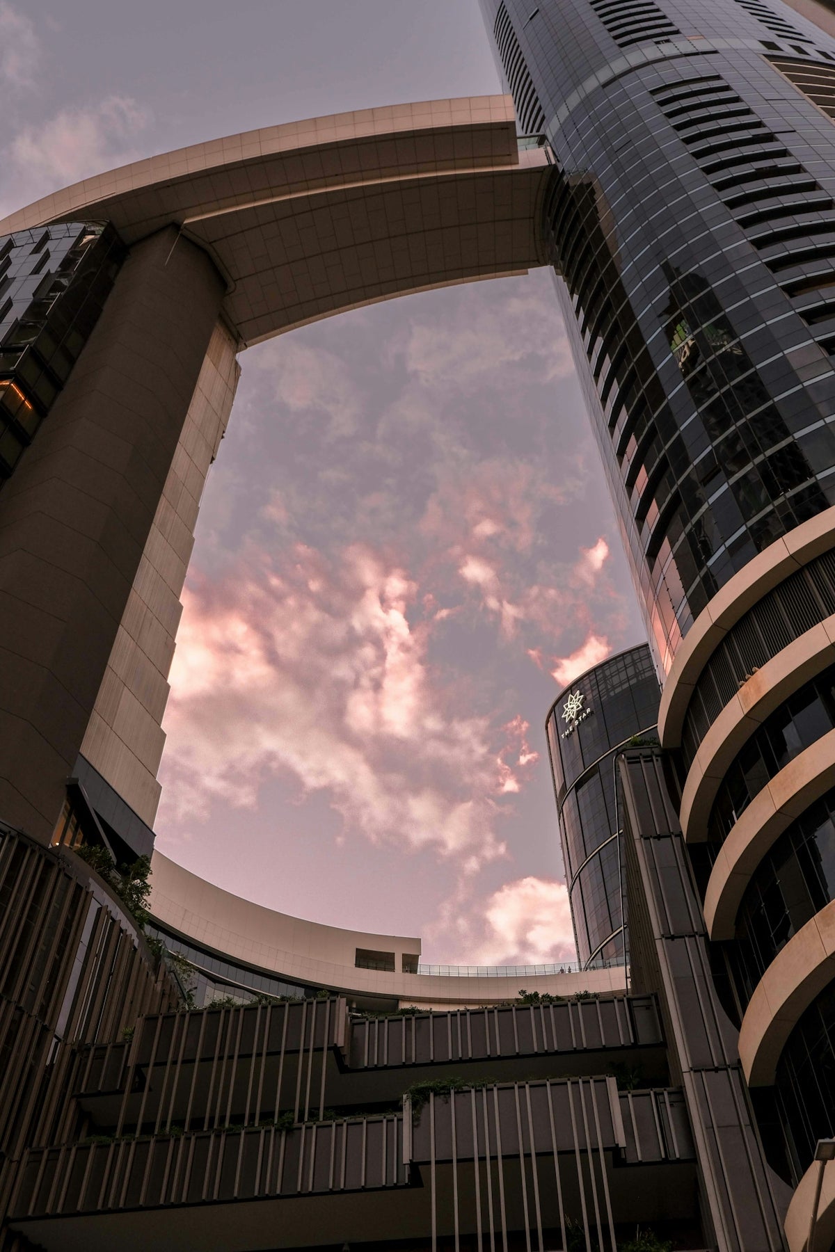 Modern buildings with sky bridge at sunset