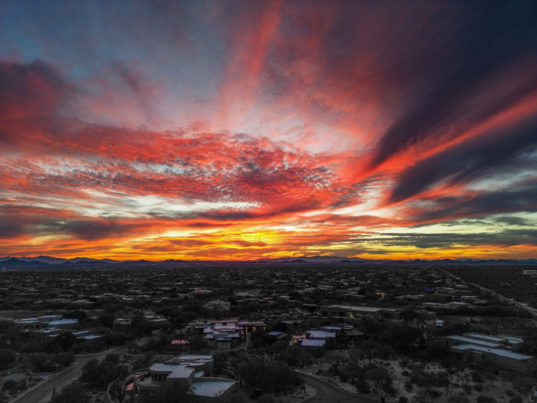 Dramatic sunset sky over a suburban landscape