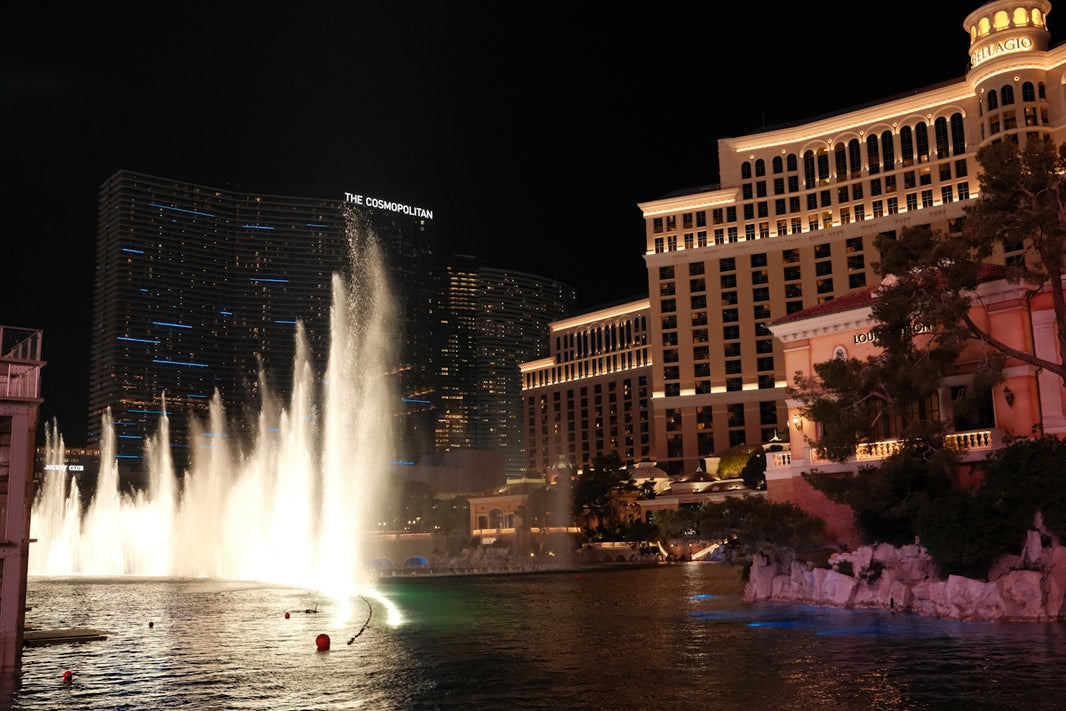 Bellagio fountains light up las vegas strip at night