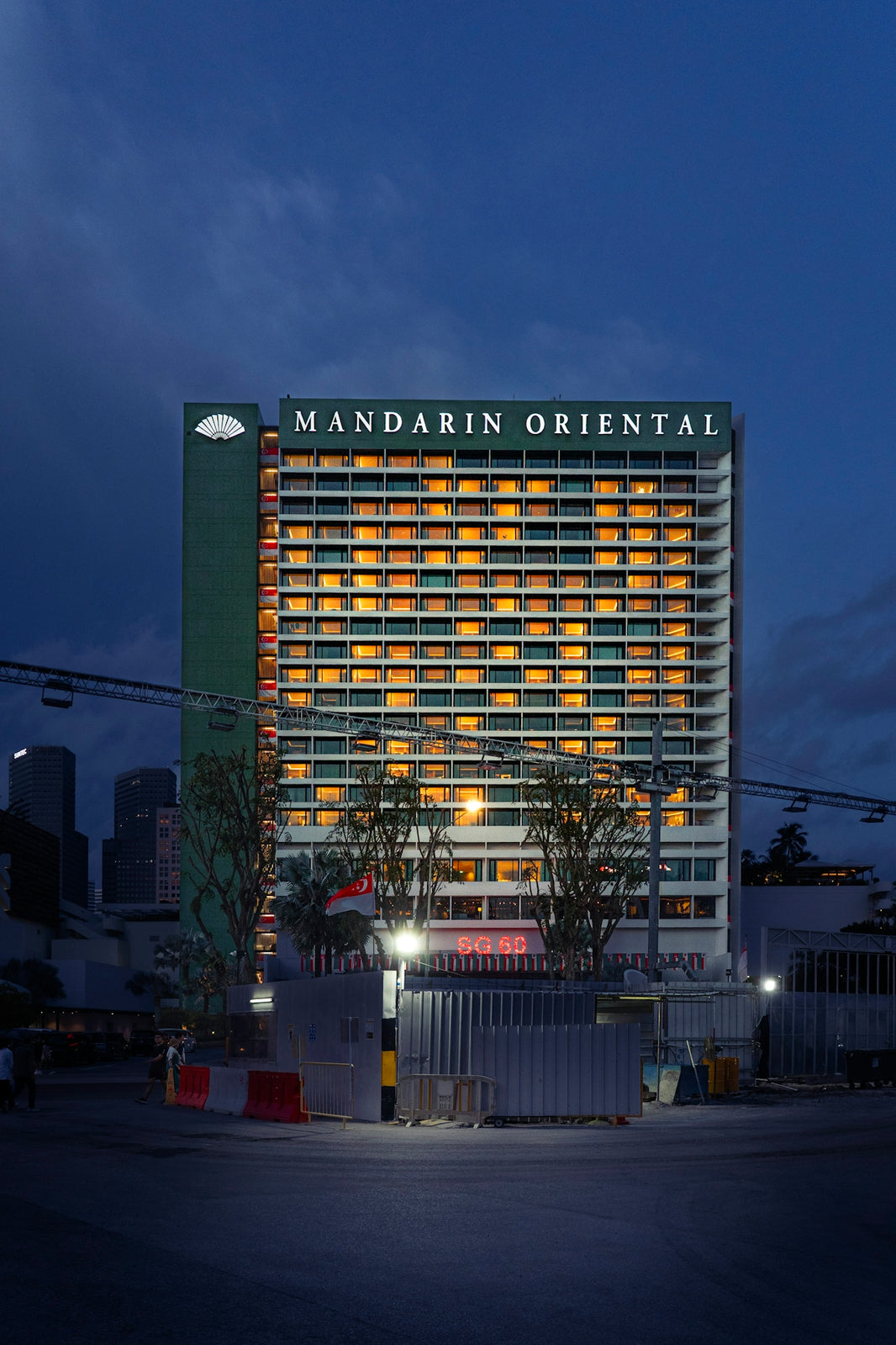 Mandarin oriental hotel building illuminated at dusk