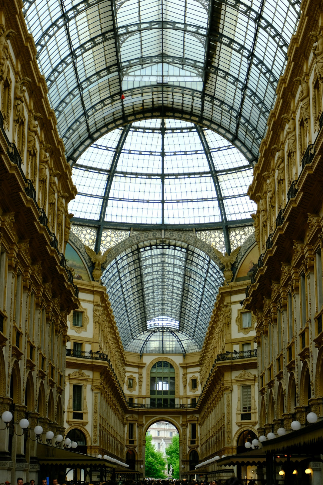 Grand glass-domed arcade with ornate architecture