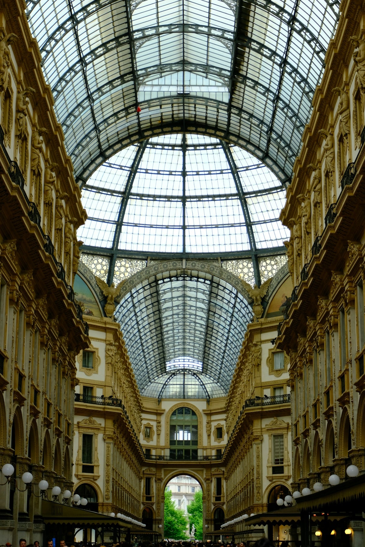Grand glass-domed arcade with ornate architecture