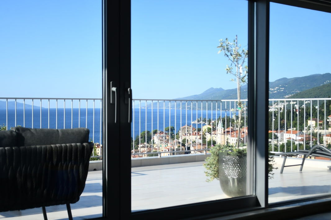 Balcony overlooking the sea and coastal town