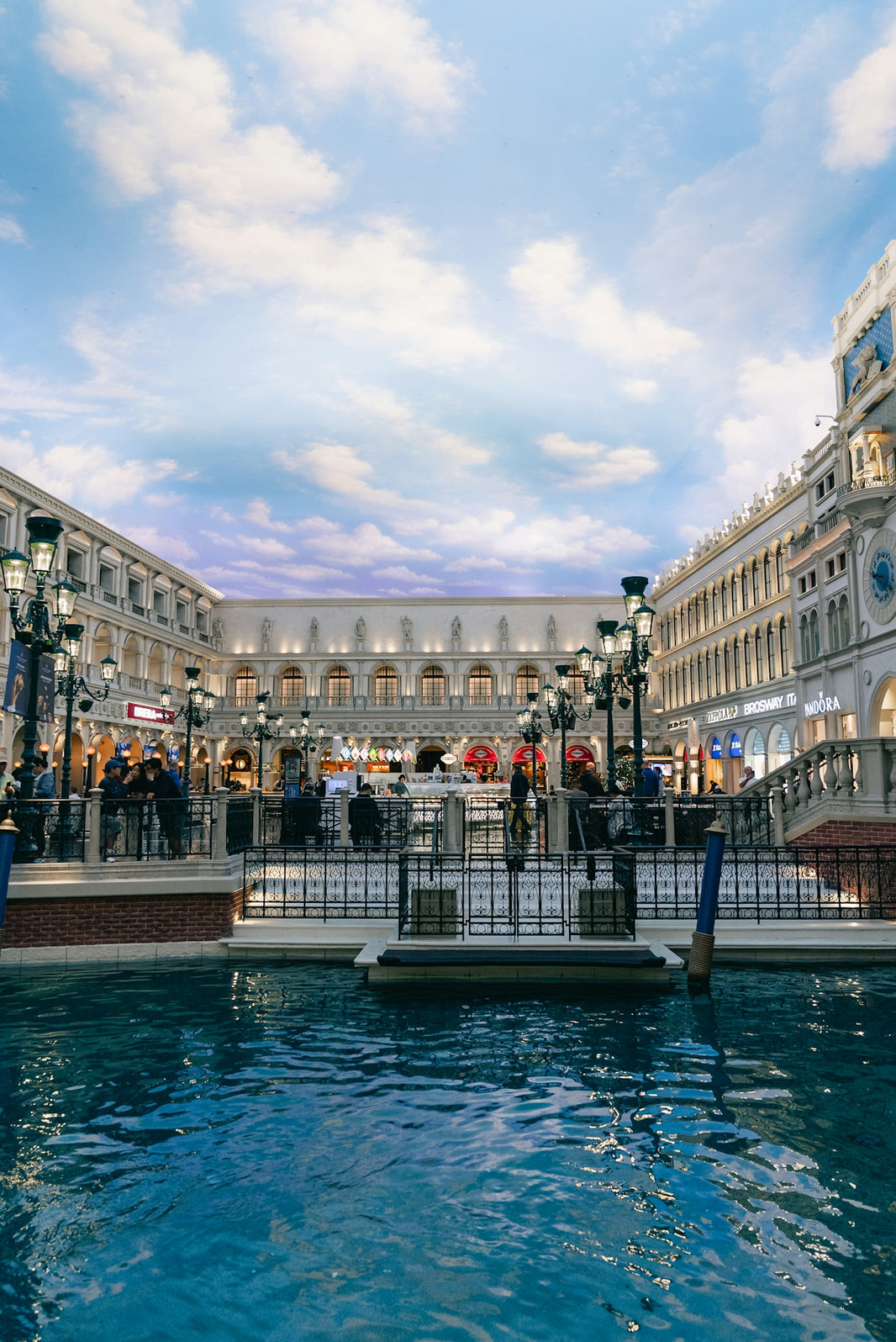 Venetian-style canal with buildings and people