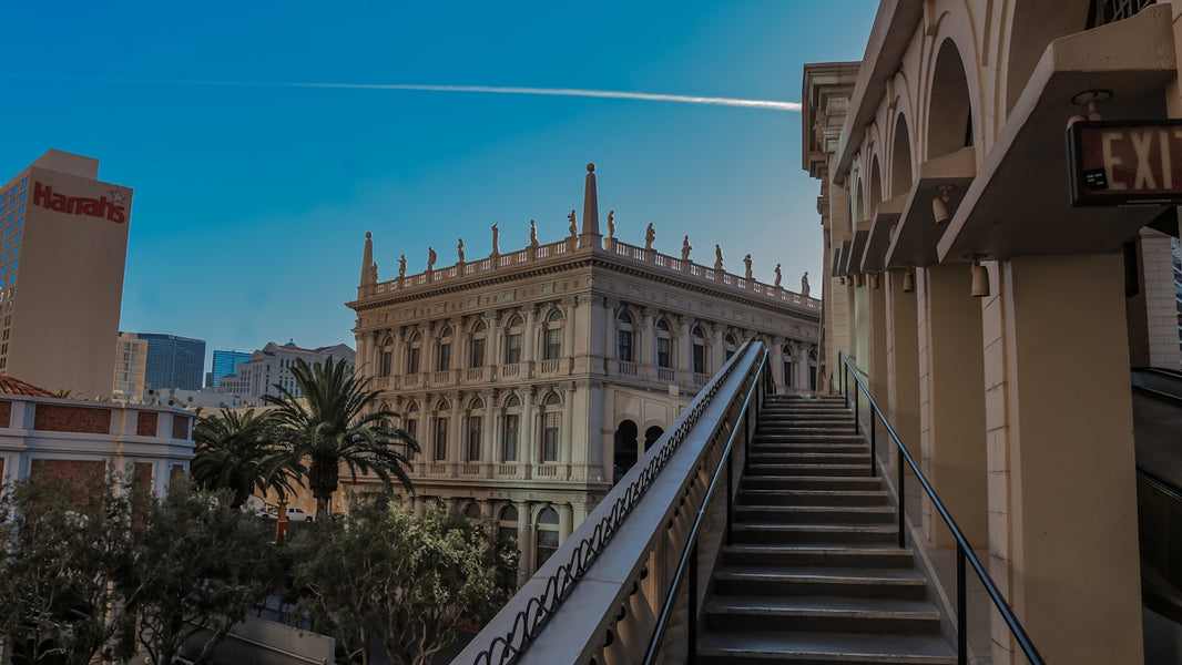 Grand building with ornate details under clear blue sky