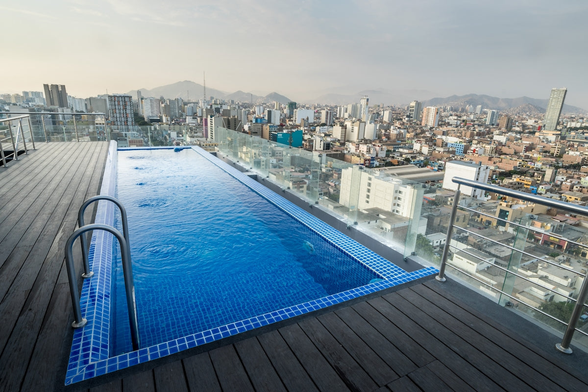 Rooftop infinity pool overlooking a sprawling cityscape