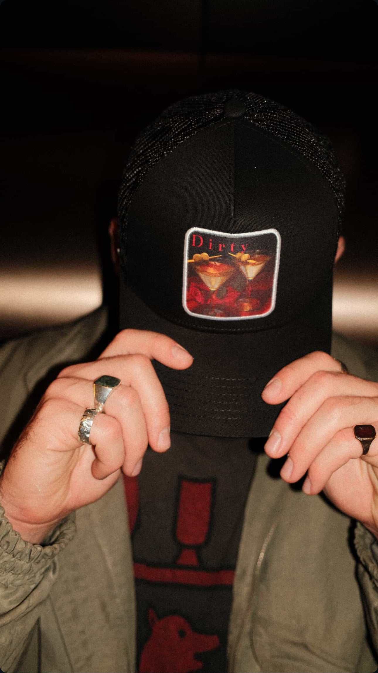 Dirty Martini Trucker Hat in black with mesh back and signature patch