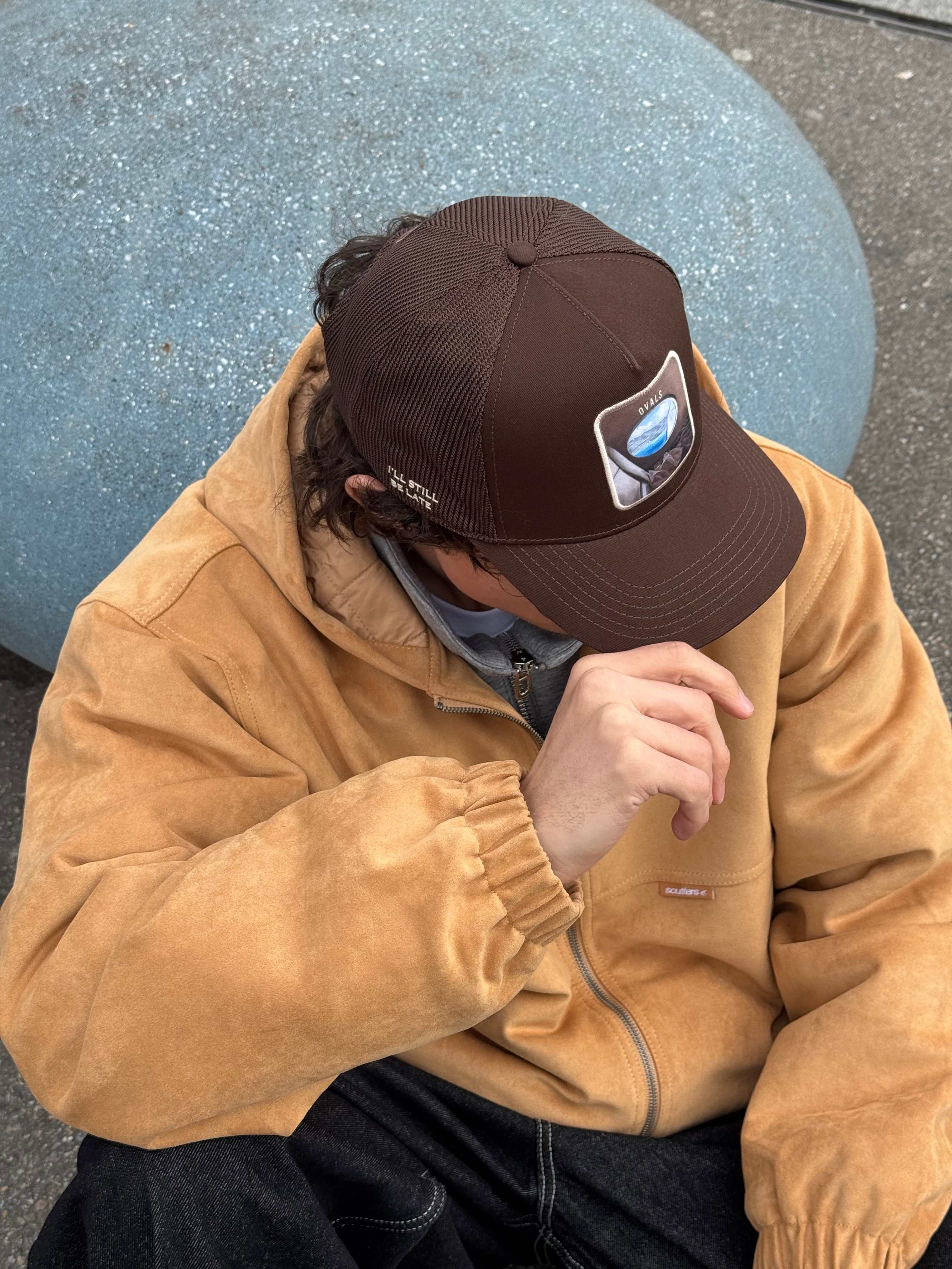 Brown Ovals Mesh-Back Trucker Hat with chestnut front and tan mesh back featuring embroidered Oval’s patch