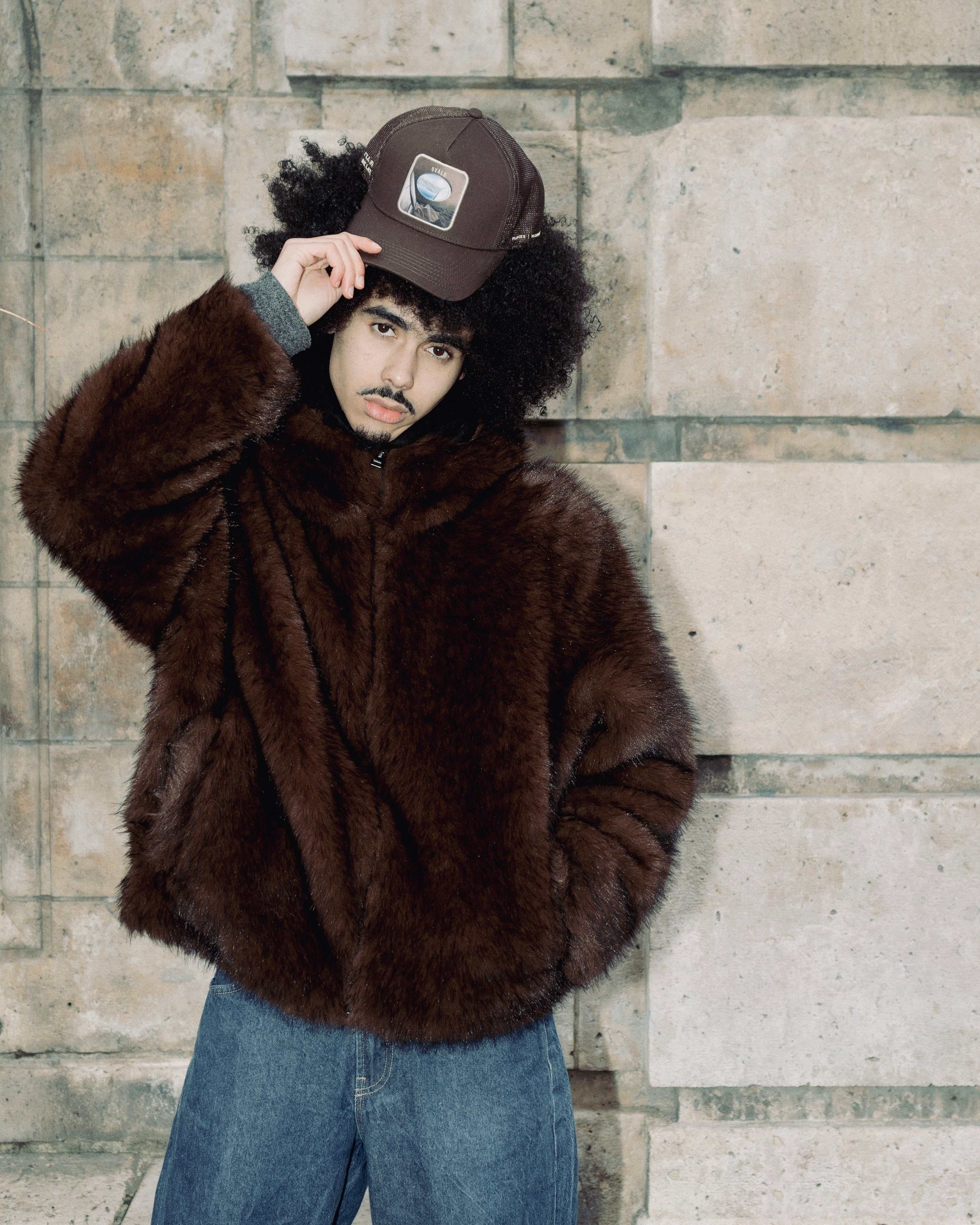 Brown Ovals Mesh-Back Trucker Hat with breathable tan mesh and embroidered patch