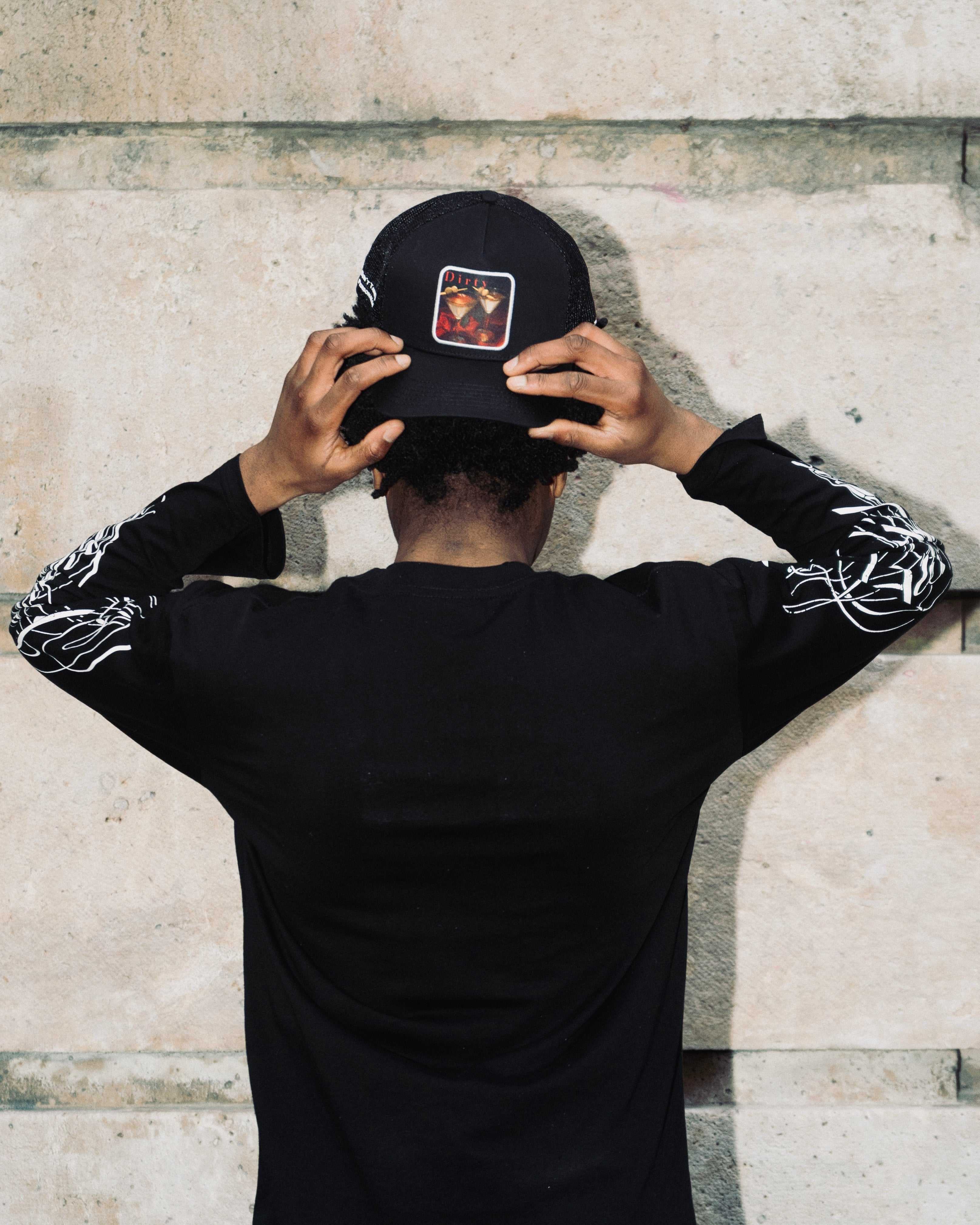Dirty Martini Trucker Hat in black with mesh back and signature patch