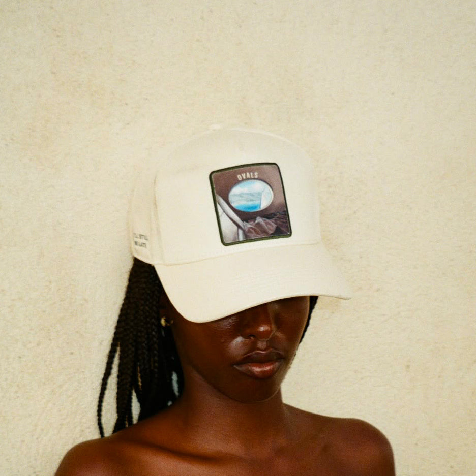 Ovals Baseball Cap in cream cotton with green oval window patch and adjustable snapback