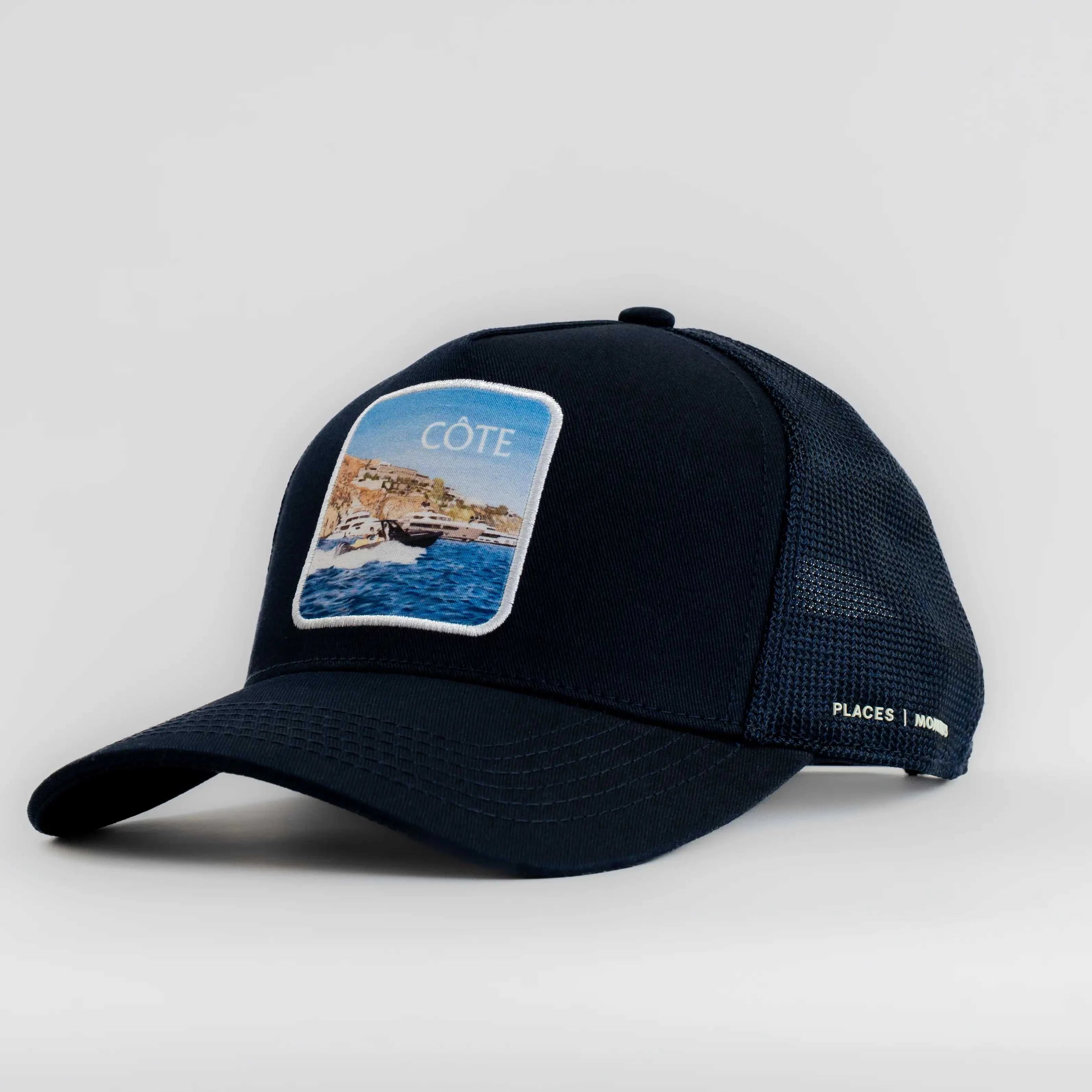 Navy Côte Mesh-Back Trucker Hat with structured front, breathable mesh back, curved brim, and coastal patch logo