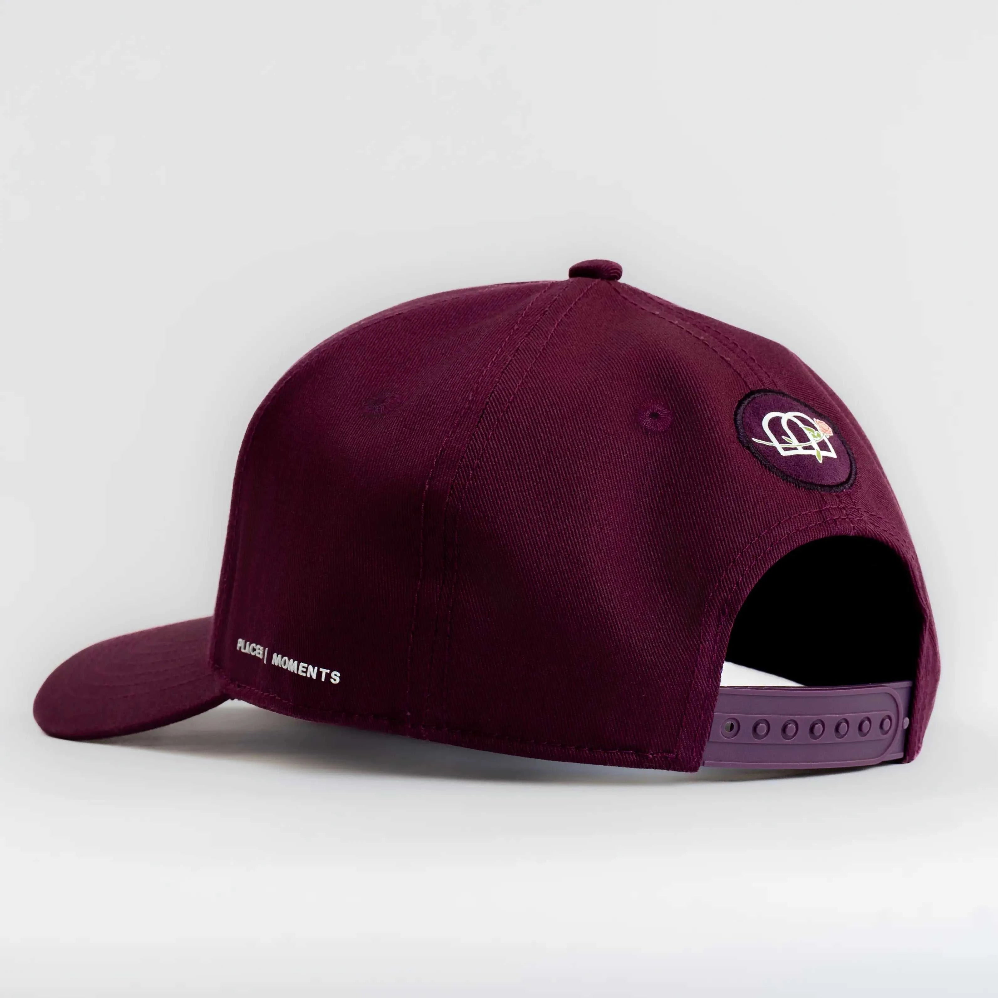 Dirty Martini Baseball Cap in Indian Creek Red with curved brim and embroidered logo badge, adjustable snapback closure.