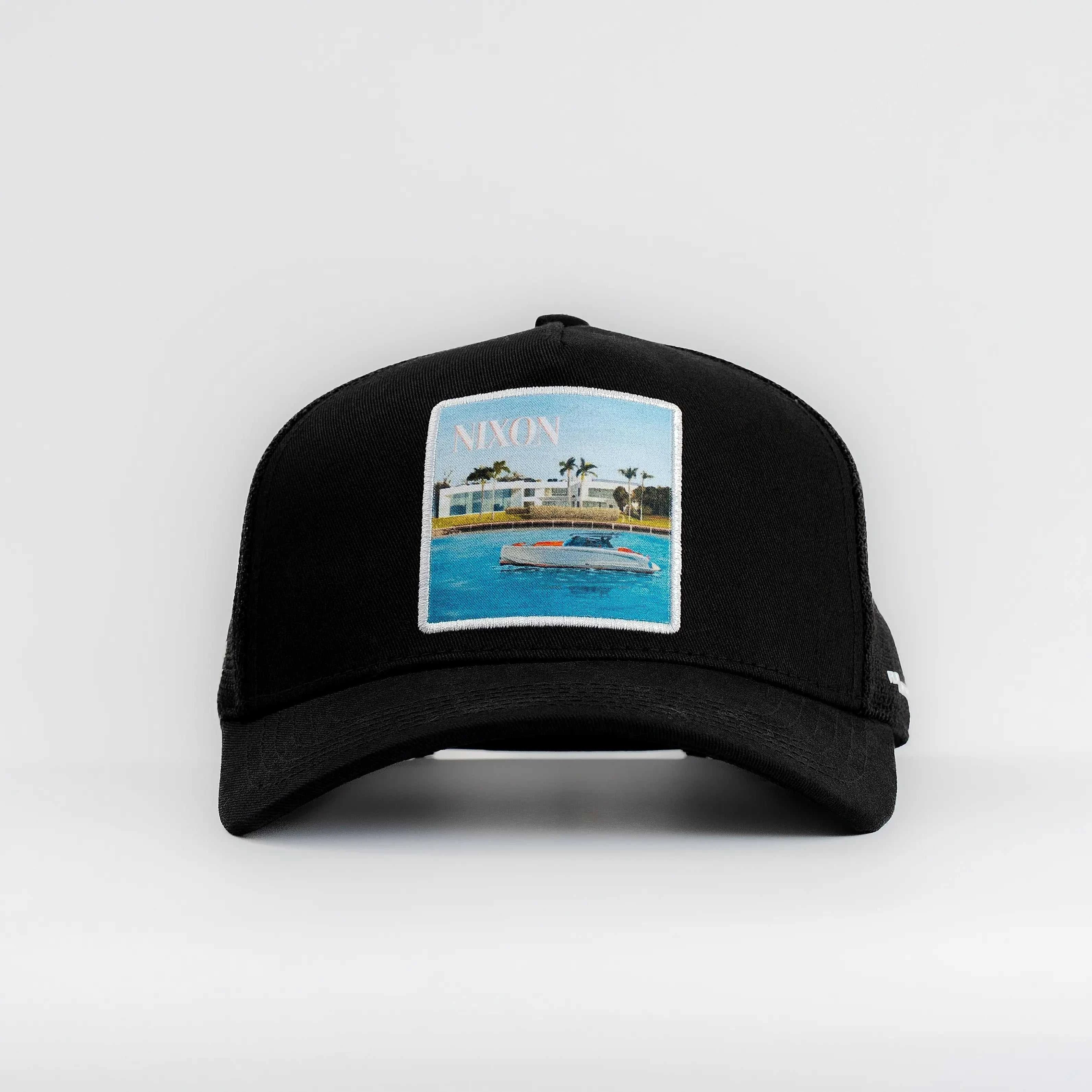 Black Nixon Mesh-Back Trucker Hat with structured front panel and embroidered patch