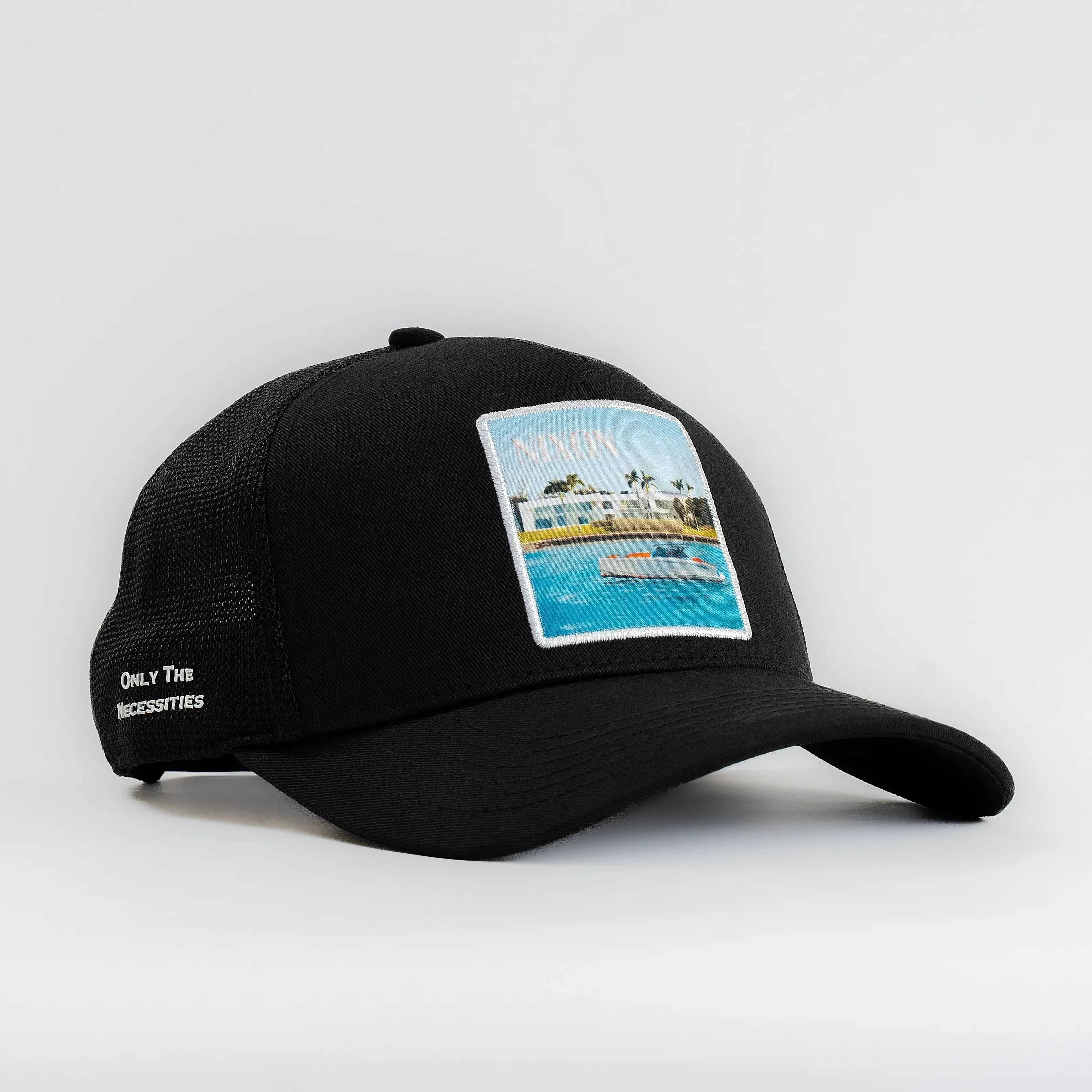 Black Nixon Mesh-Back Trucker Hat with structured front, breathable mesh back, curved brim, and embroidered patch