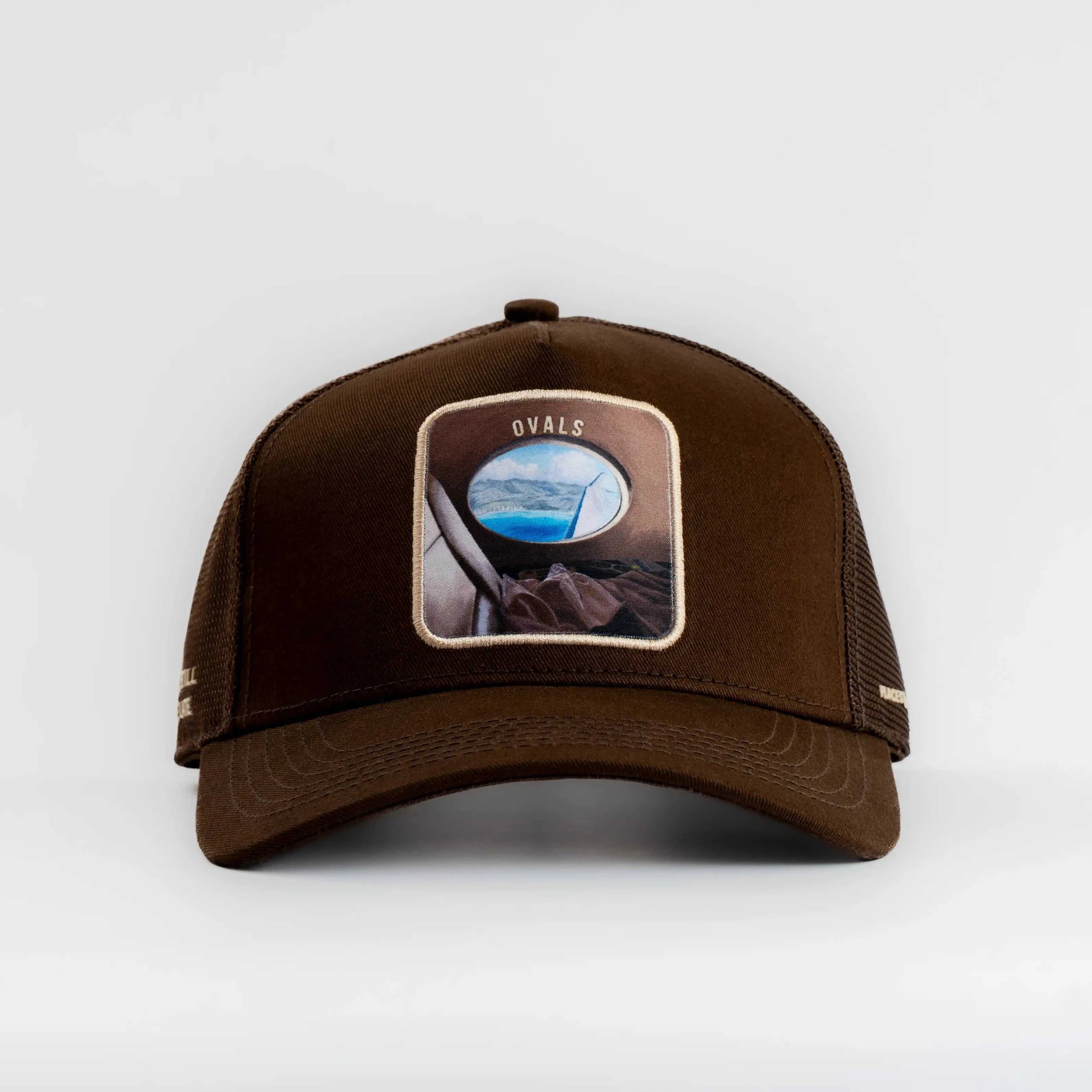 Ovals Mesh-Back Trucker Hat in brown with chestnut front panel, tan mesh back, curved brim, and vintage embroidered patch