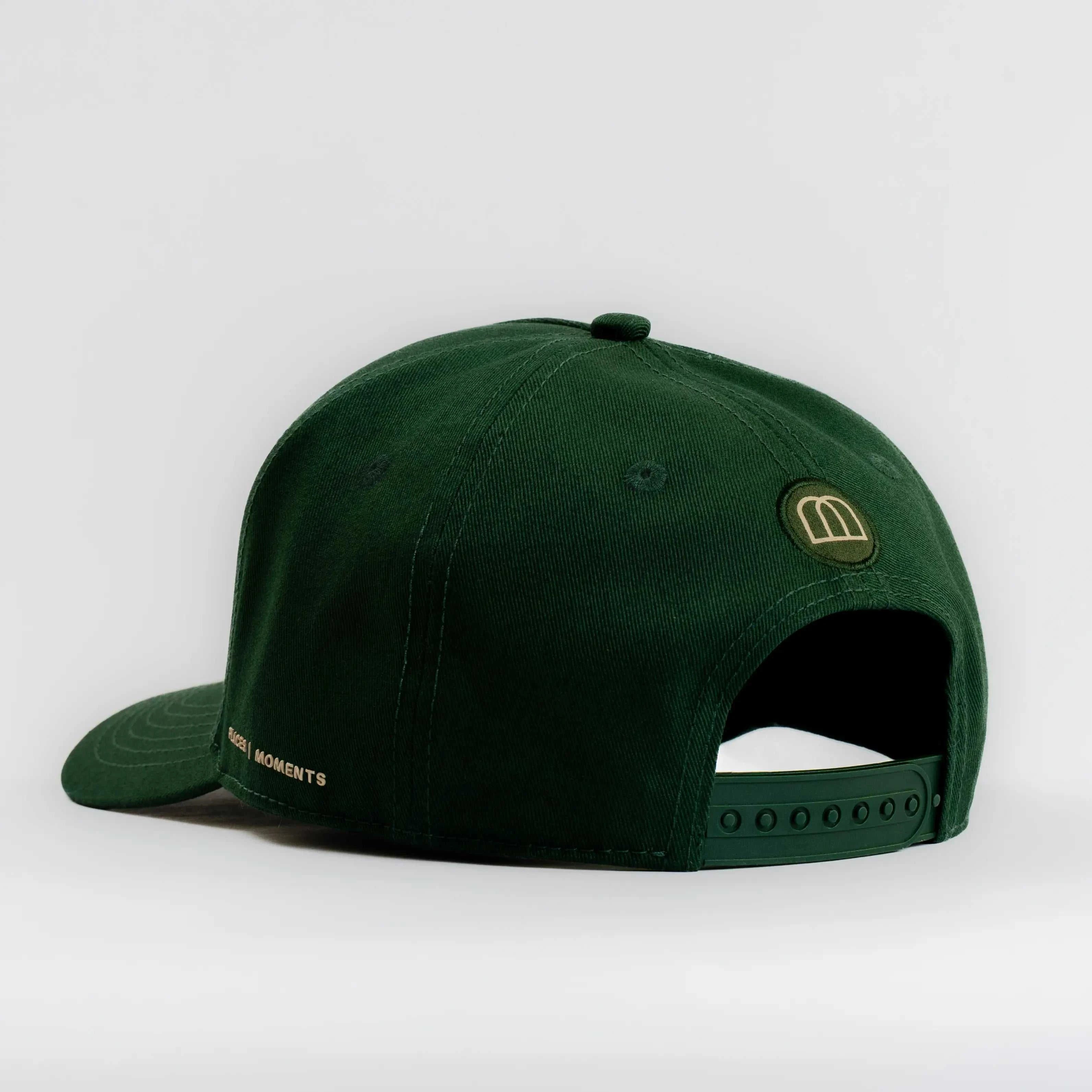 Dark green Ovals Baseball Cap with embroidered logo and adjustable strap, made from soft cotton.