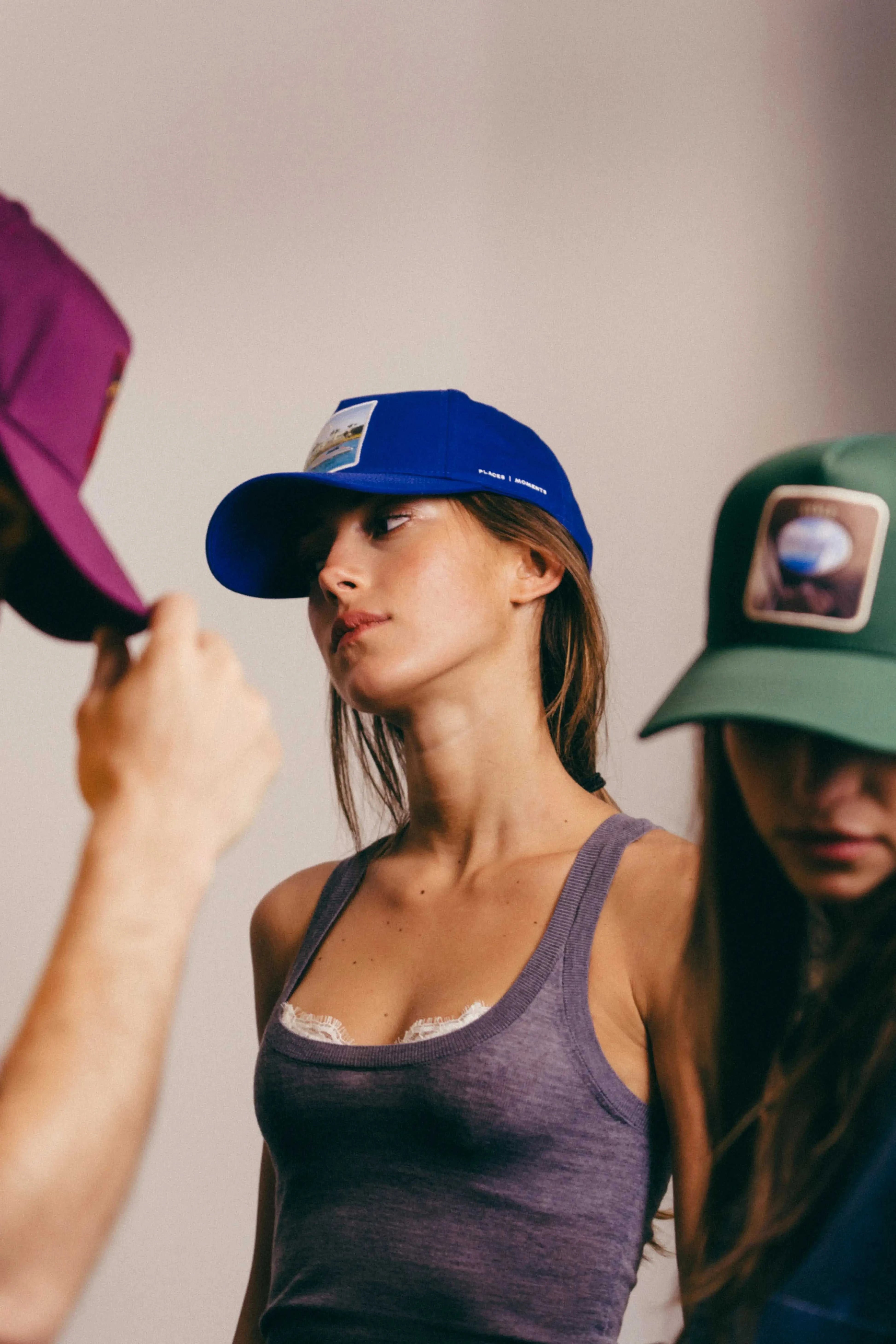 Blue Nixon Baseball Cap with structured crown and curved brim worn by woman