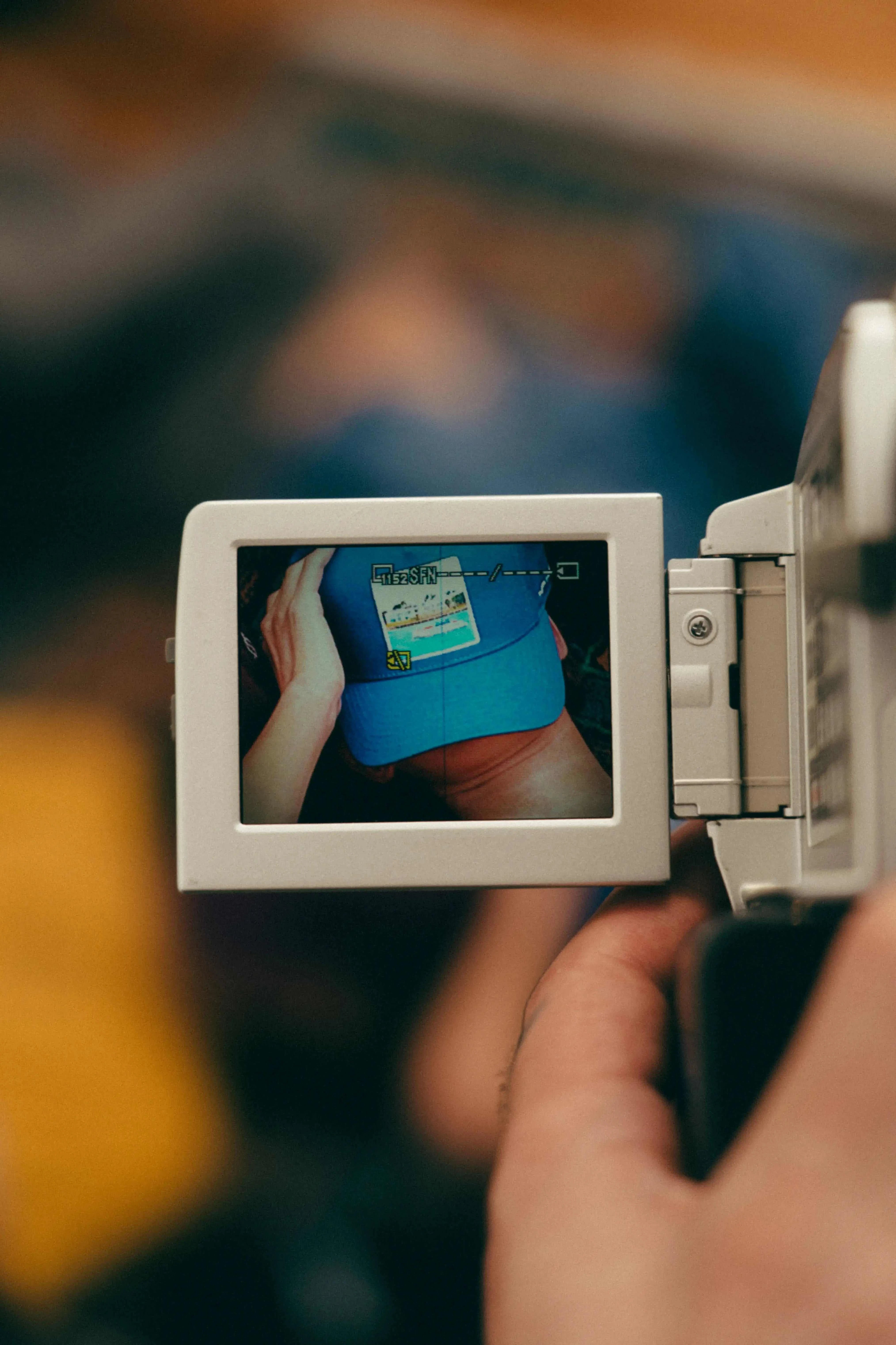 Blue Nixon Baseball Cap with Places | Moments patch on a digital camera screen