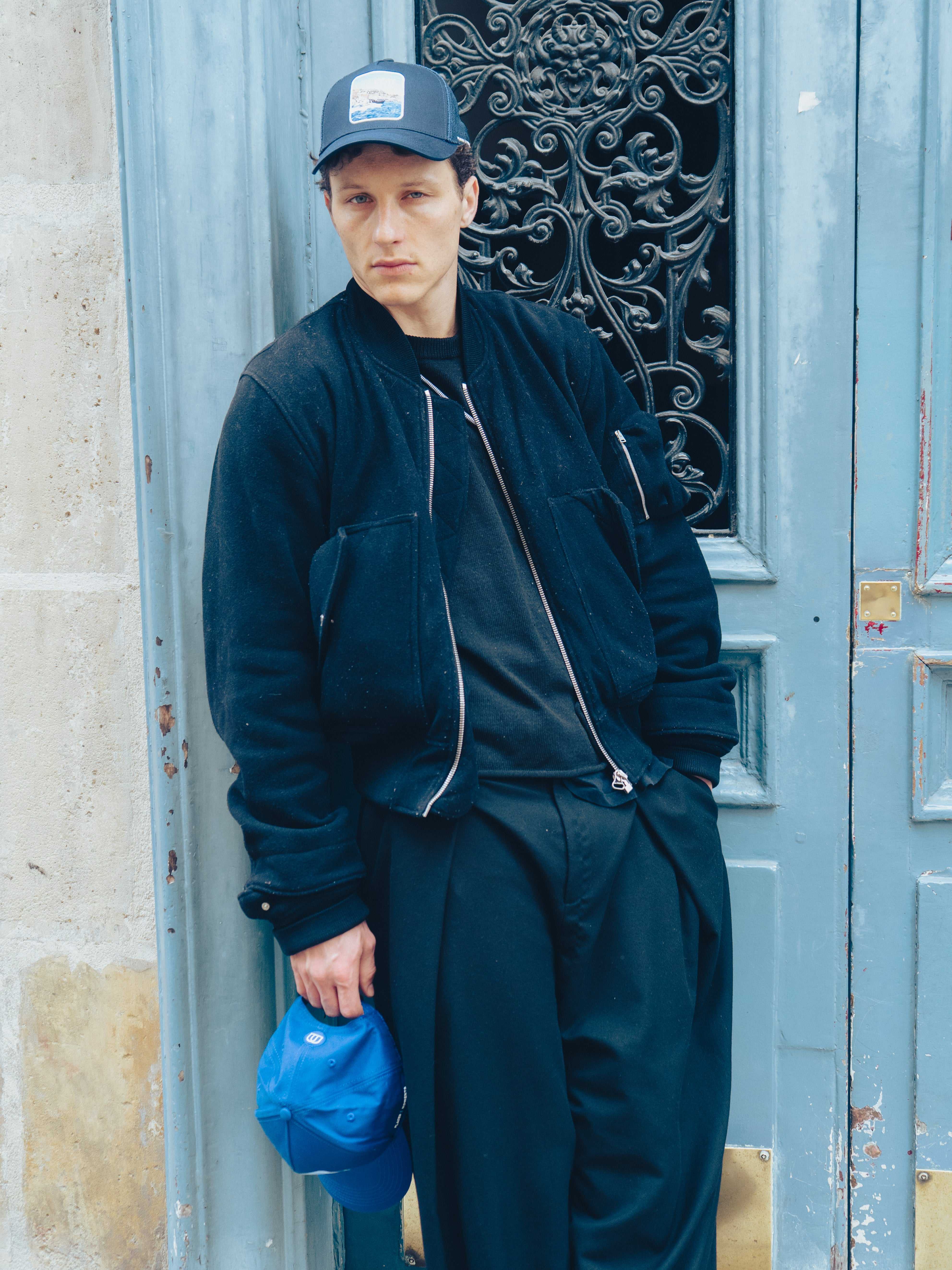 Côte Mesh-Back Trucker Hat in Indie Blue with breathable mesh back and Places | Moments signature patch