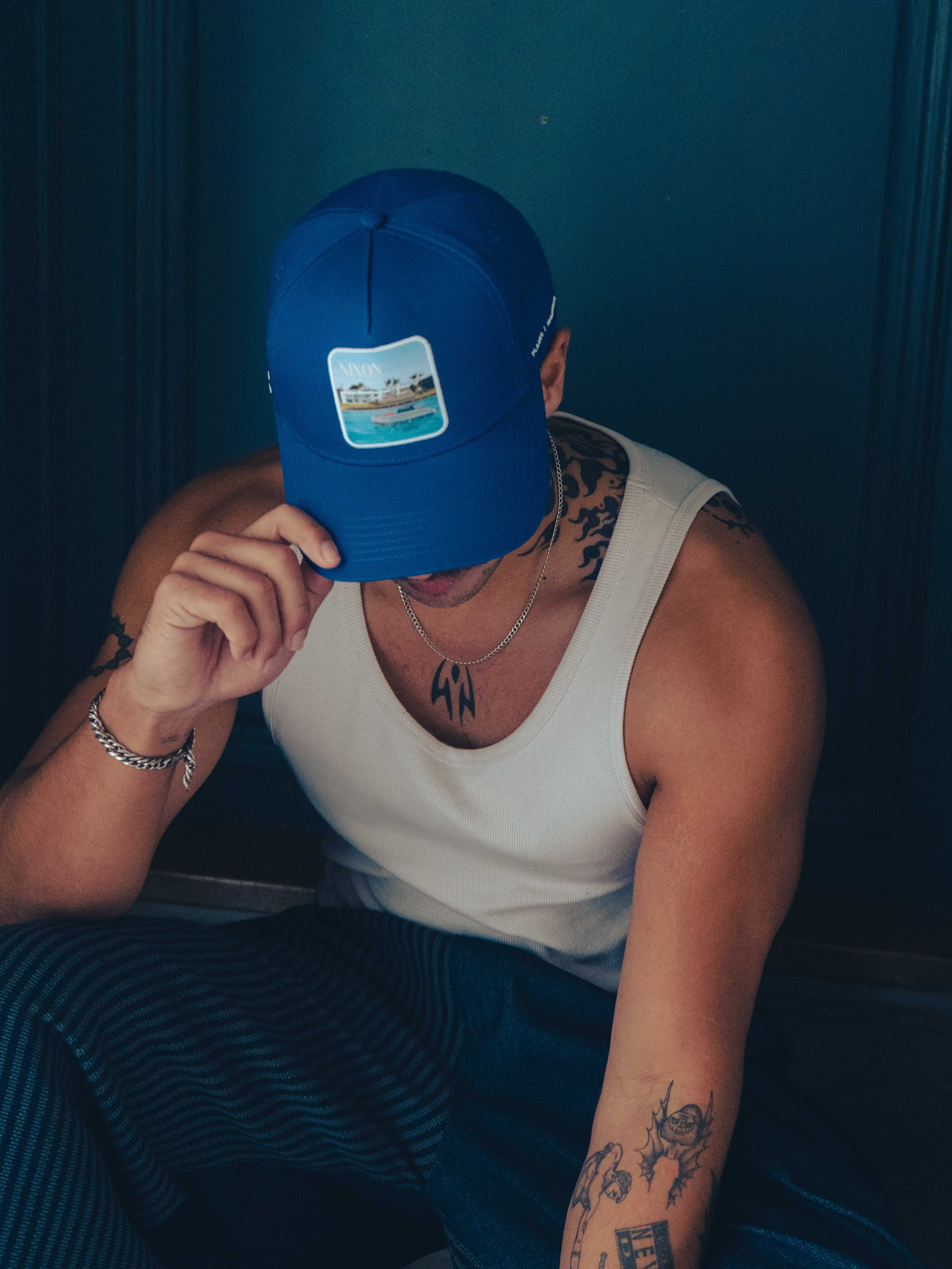 Blue Nixon Baseball Cap with curved brim and Places | Moments patch