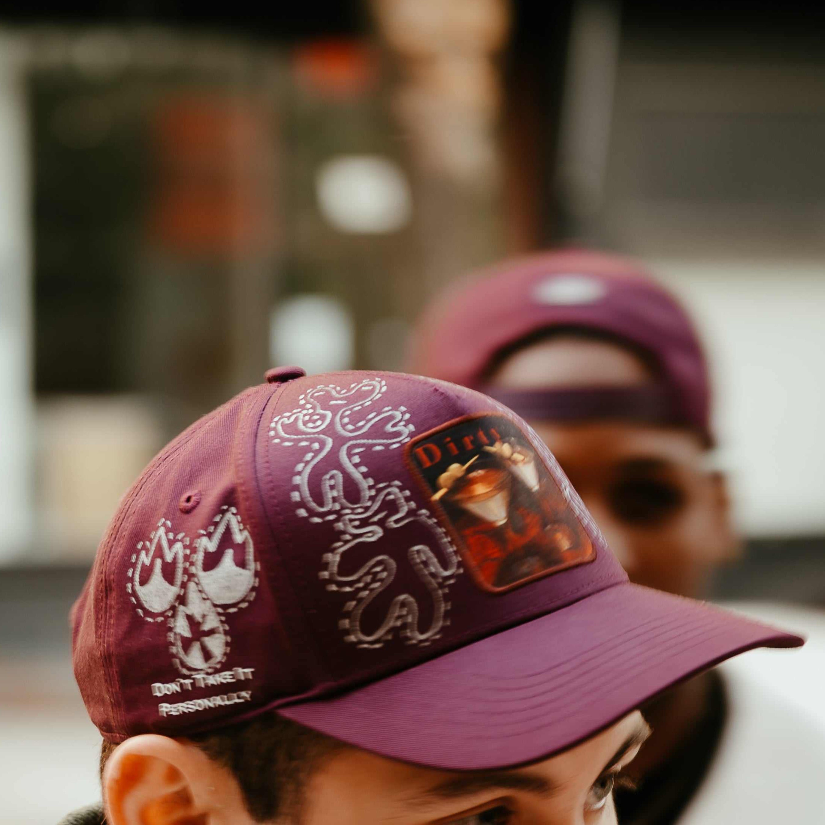 Dirty Martini limited edition baseball cap hand-painted by artist Muji with unique organic characters