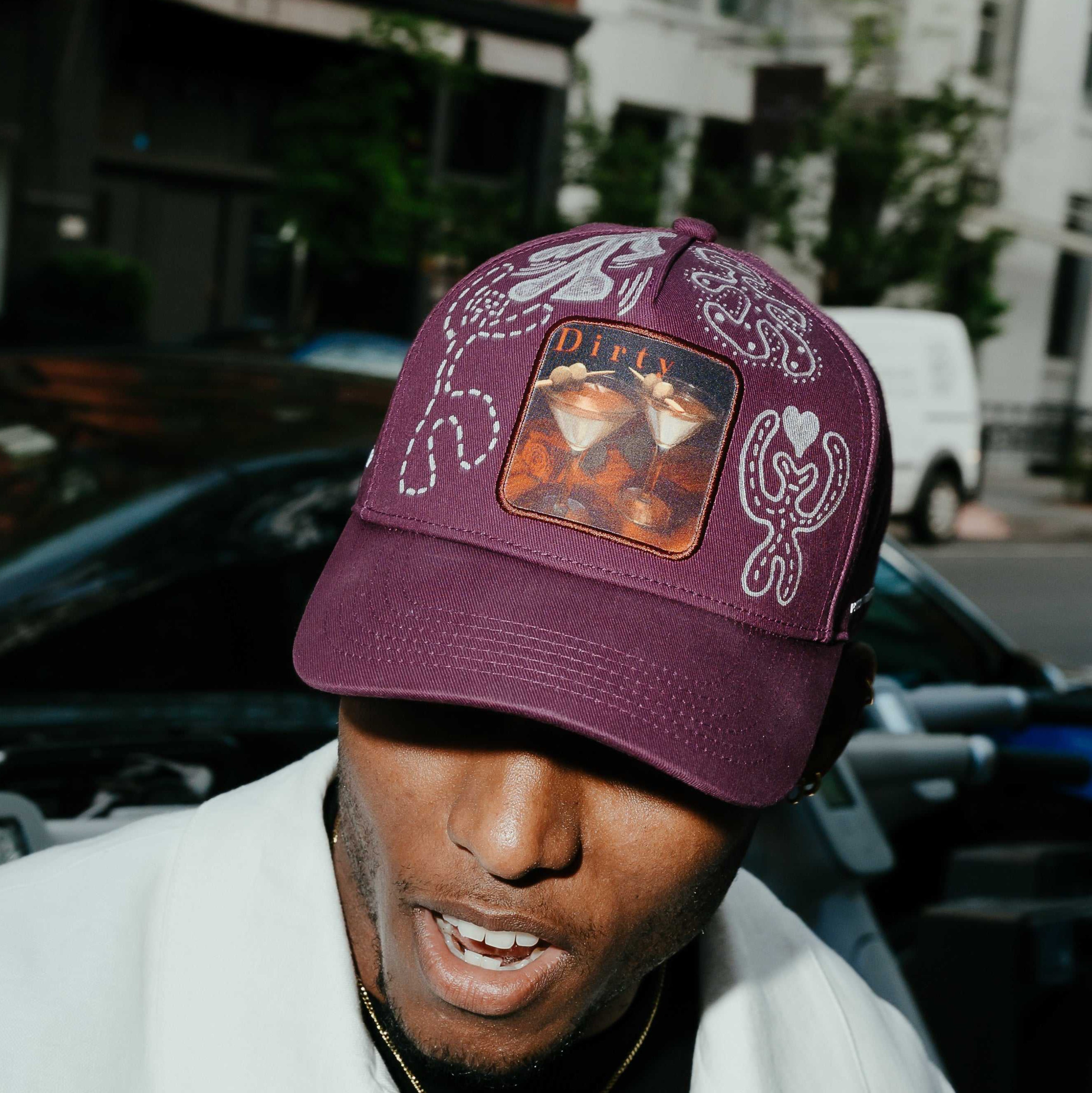 Dirty Martini × Muji limited edition Indian Creek Red baseball cap with unique hand-drawn artwork and raised lettering
