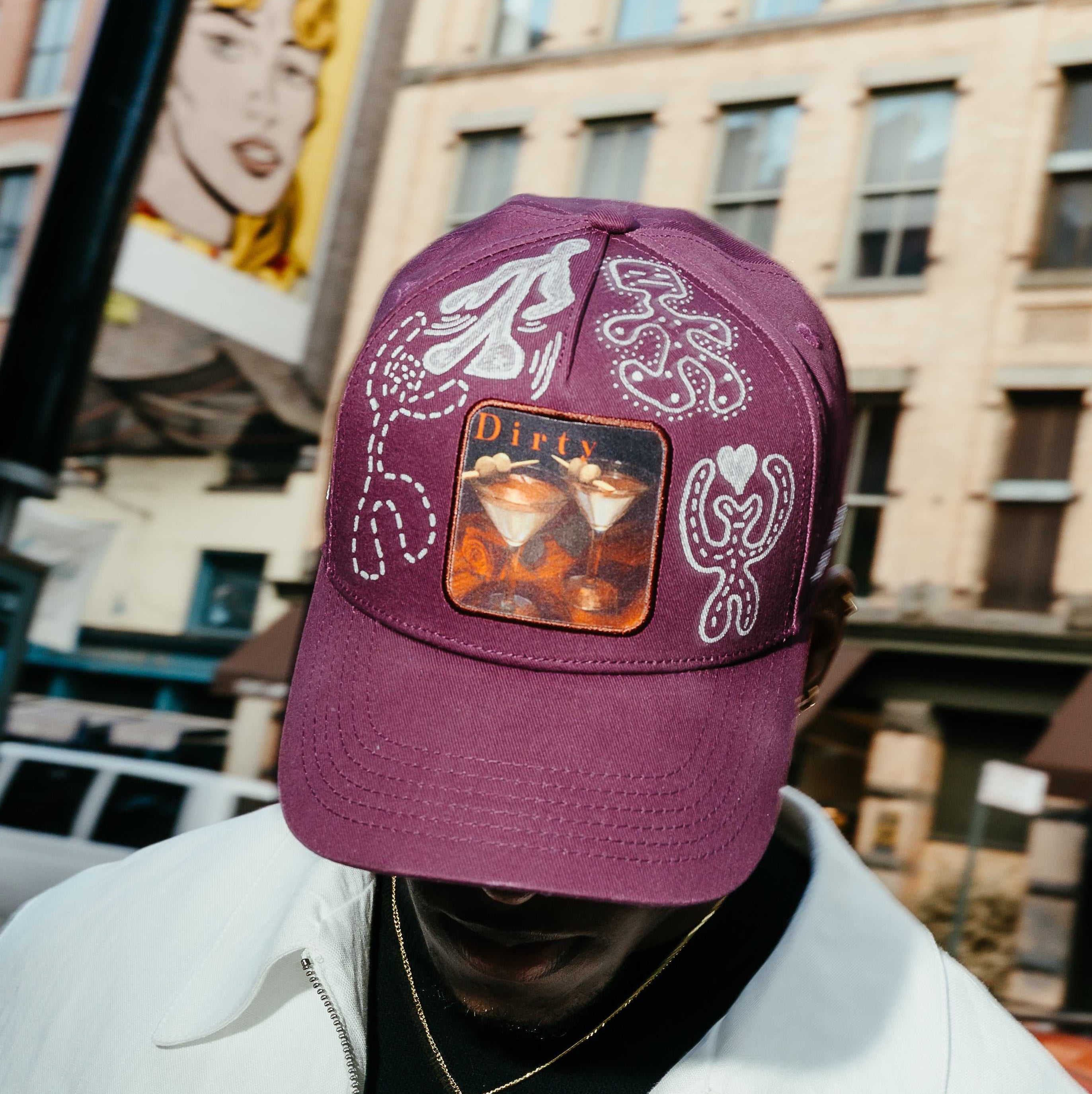 Dirty Martini x Muji limited edition Indian Creek Red baseball cap with hand-drawn artwork and "Don't Take It Personally" lettering