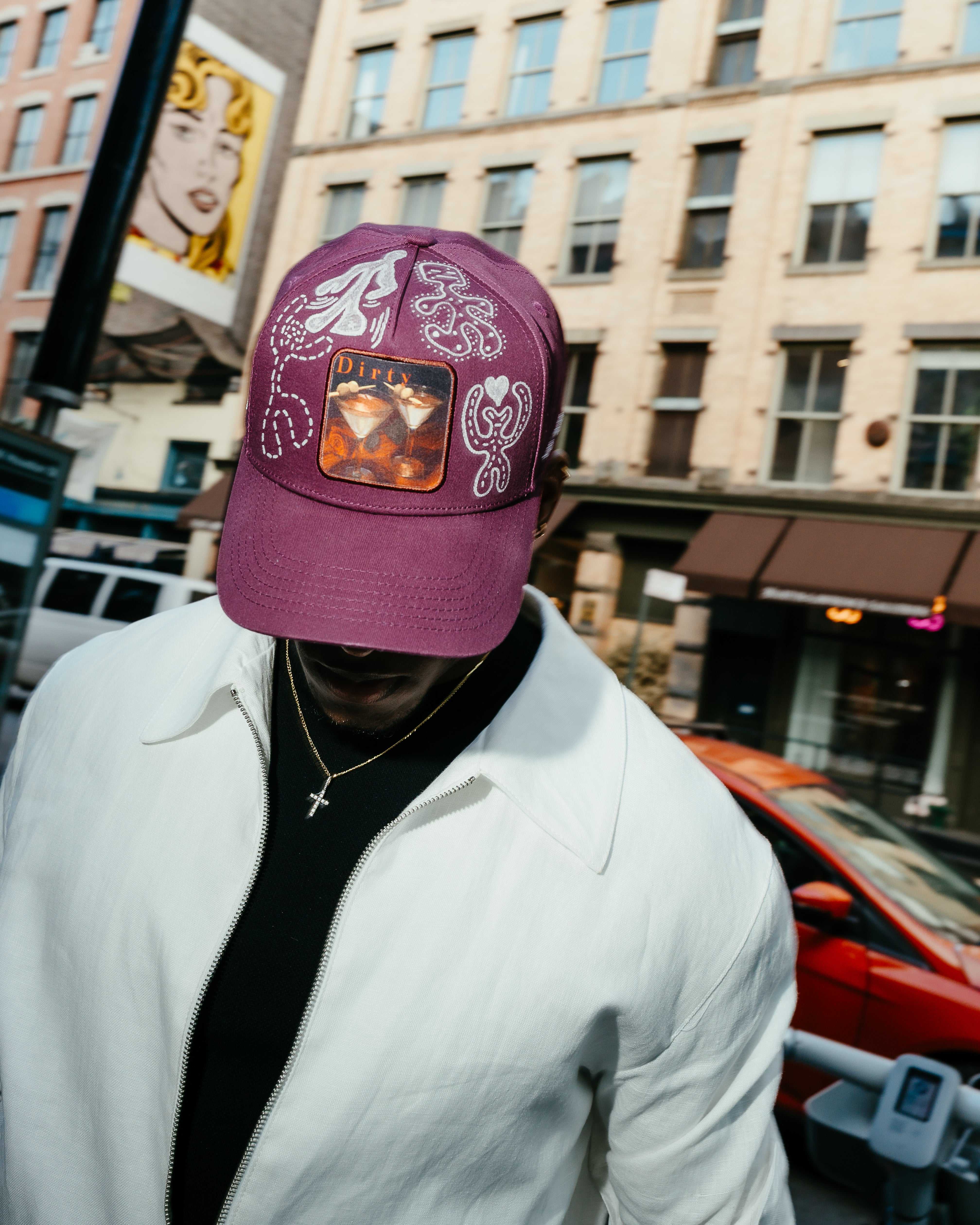 Dirty Martini x Muji limited edition Indian Creek Red baseball cap with hand-drawn artwork and "Don't Take It Personally" lettering